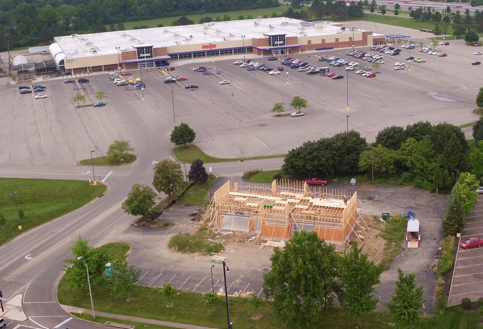 A new Popeye’s restaurant is under construction in front of the Meijer store and is one of many new construction projects underway along the Wilmington Pike corridor. TY GREENLEES / STAFF