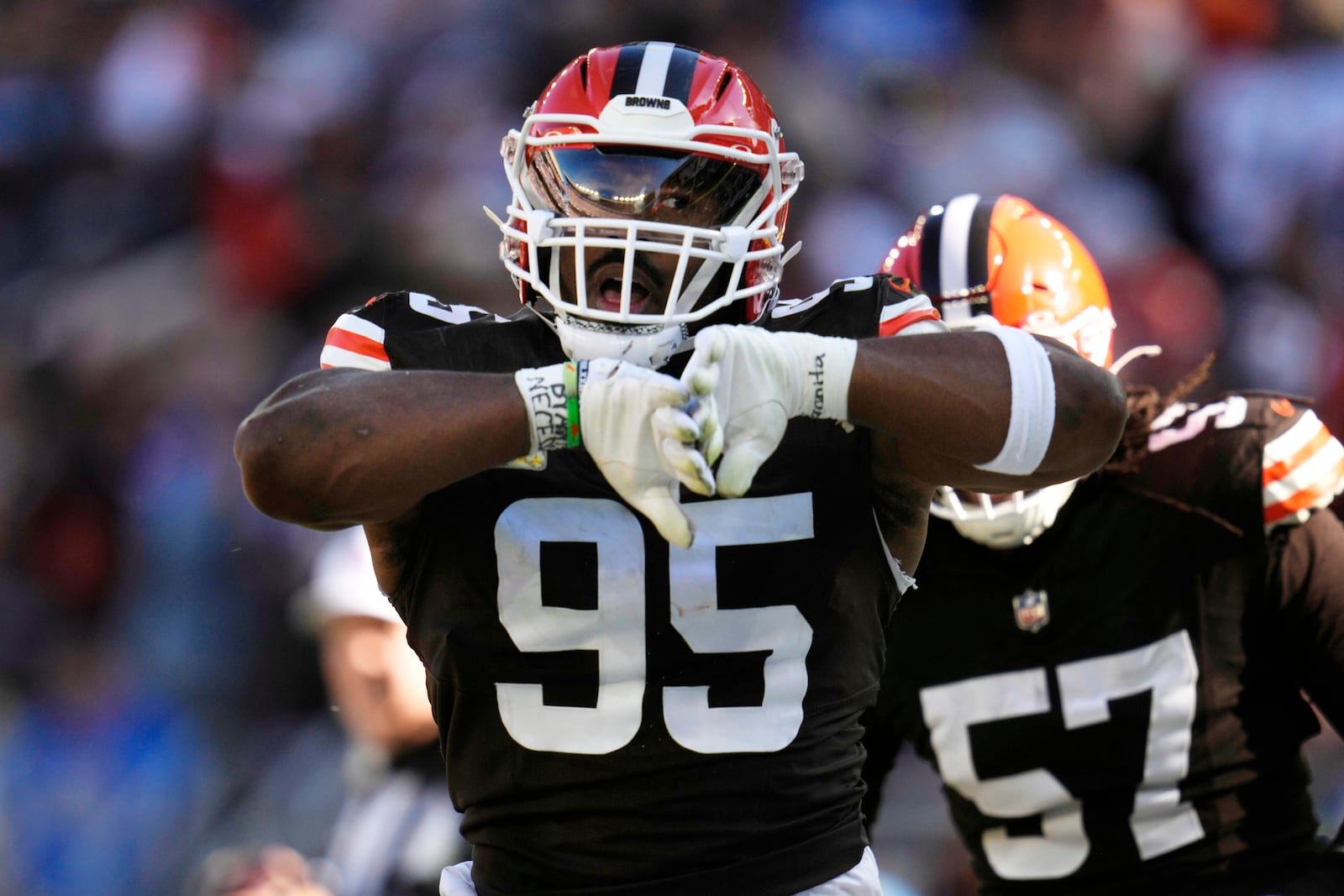 Cleveland Browns defensive end Myles Garrett (95) celebrates after sacking Los Angeles Chargers quarterback Justin Herbert in the first half of an NFL football game Sunday, Nov. 3, 2024, in Cleveland. (AP Photo/Sue Ogrocki)