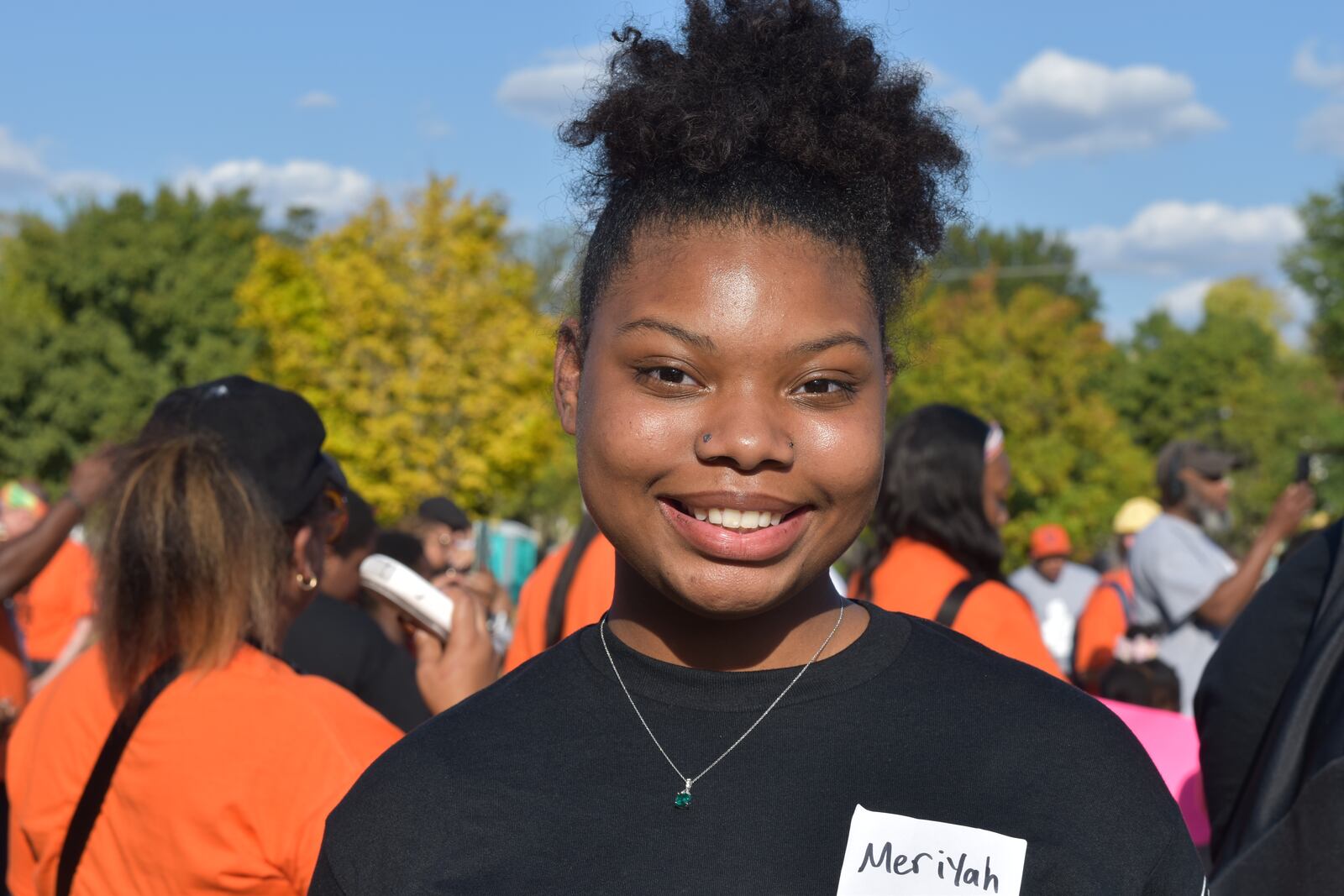 Meriyah Lawrence, 15, a student at Thurgood Marshall STEM High School, read a poem she wrote about gun violence at a peace rally in northwest Dayton on Sept. 19, 2024. CORNELIUS FROLIK / STAFF