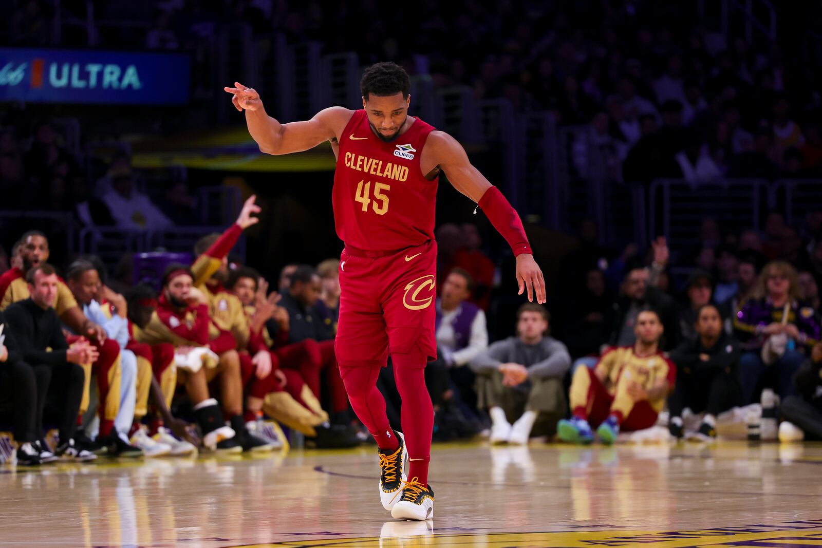 Cleveland Cavaliers guard Donovan Mitchell celebrates after a 3-point basket during the second half of an NBA basketball game against the Los Angeles Lakers, Tuesday, Dec. 31, 2024, in Los Angeles. (AP Photo/Ryan Sun)