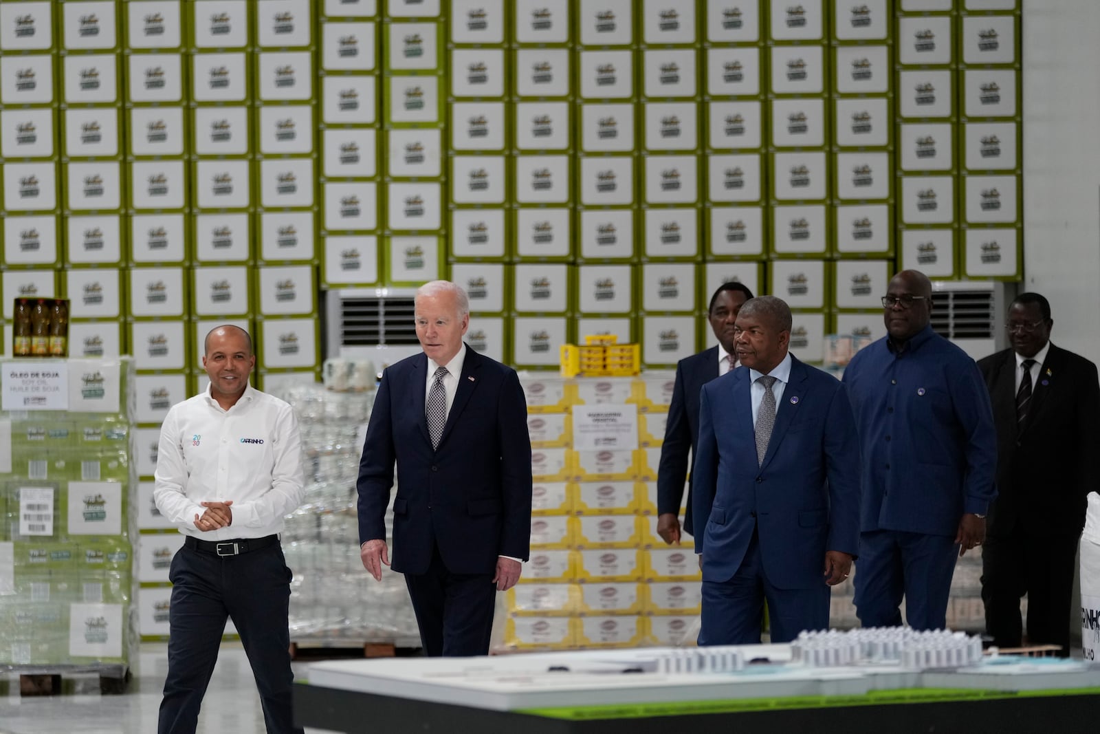 President Joe Biden, followed by, from the left, Angola's President Joao Lourenco, Zambia President Hakainde Hichilema, Zambia President Hakainde Hichilema, and Vice President of Tanzania Philip Isdor Mpango, arrives at the Carrinho food processing factory near Lobito, Angola on Wednesday, Dec. 4, 2024. (AP Photo/Ben Curtis)