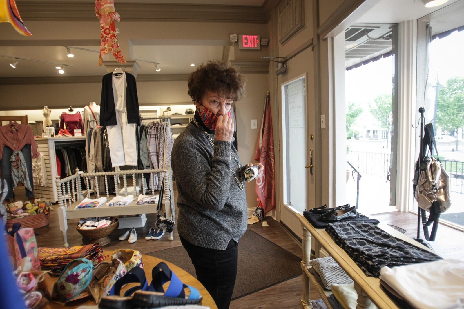 Bonnie Geiger, from Dayton does some shopping at the Get Dressed Boutique on Far Hills in Oakwood in 2020. JIM NOELKER/STAFF