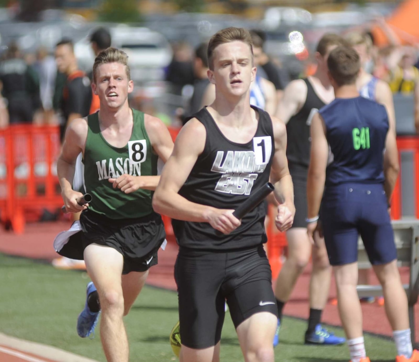 Lakota East High School junior Dustin Horter (right) anchored the distance medley relay from 12th to third during the Wayne track and field invitational at Huber Heights on Thursday, April 27, 2017. MARC PENDLETON / STAFF