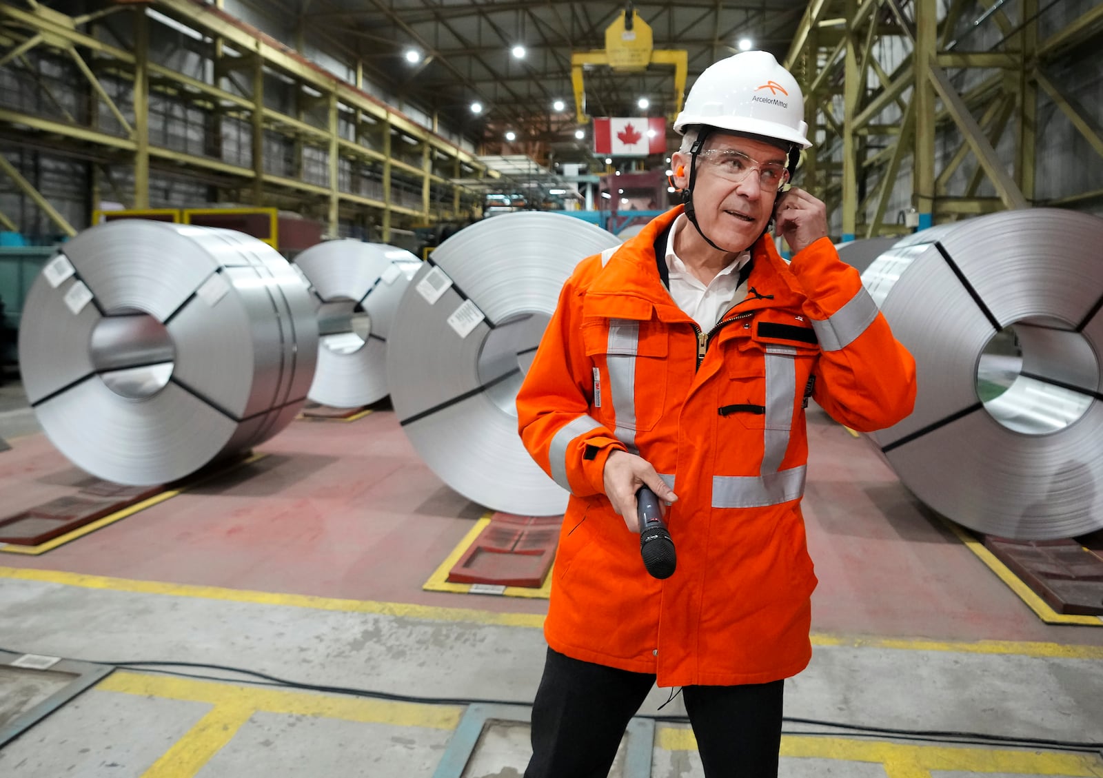 Canadian Prime Minister designate Mark Carney tours the ArcelorMittal Dofasco steel plant in Hamilton, Ontario, on Wednesday, March 12, 2025. (Nathan Denette/The Canadian Press via AP)