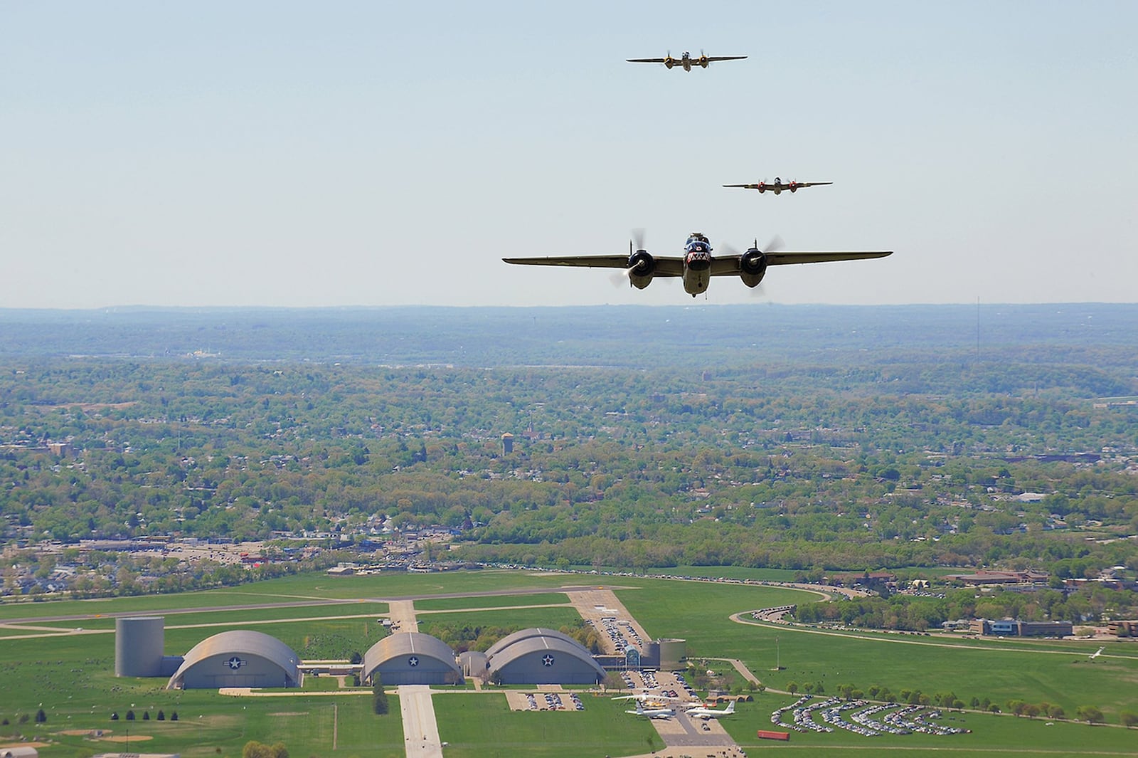 Vintage B-25 Mitchell bombers fly over the National Museum of the U.S. Air Force at Wright-Patterson Air Force Base, Ohio, during a memorial flight honoring the Doolittle Tokyo Raiders on April 18, 2010. The 68th Doolittle Raidersâ€™ reunion commemorates the anniversary of the Doolittle Tokyo Raid. On April 18, 1942, U.S. Army Air Forces Lt. Col. Jimmy Doolittleâ€™s squad of 16 B-25 Mitchell aircraft bombed Japanese targets in response to the attack on Pearl Harbor. (U.S. Air Force photo/Tech. Sgt. Jacob N. Bailey)