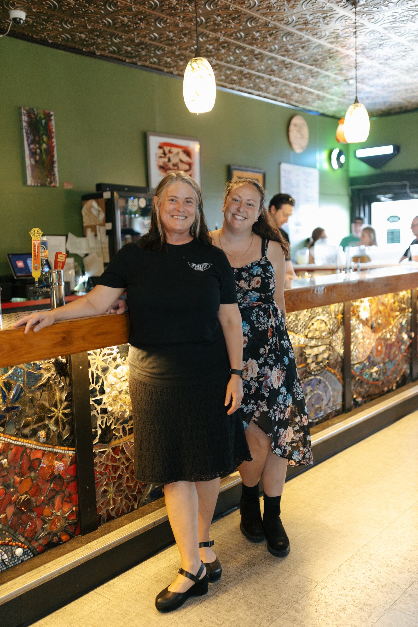 A gorgeous mosaic was recently unveiled at at Speakeasy Ramen across the bar front that Kim Frazier has been working on since 2020 with Speakeasy GM Brittany Walters.