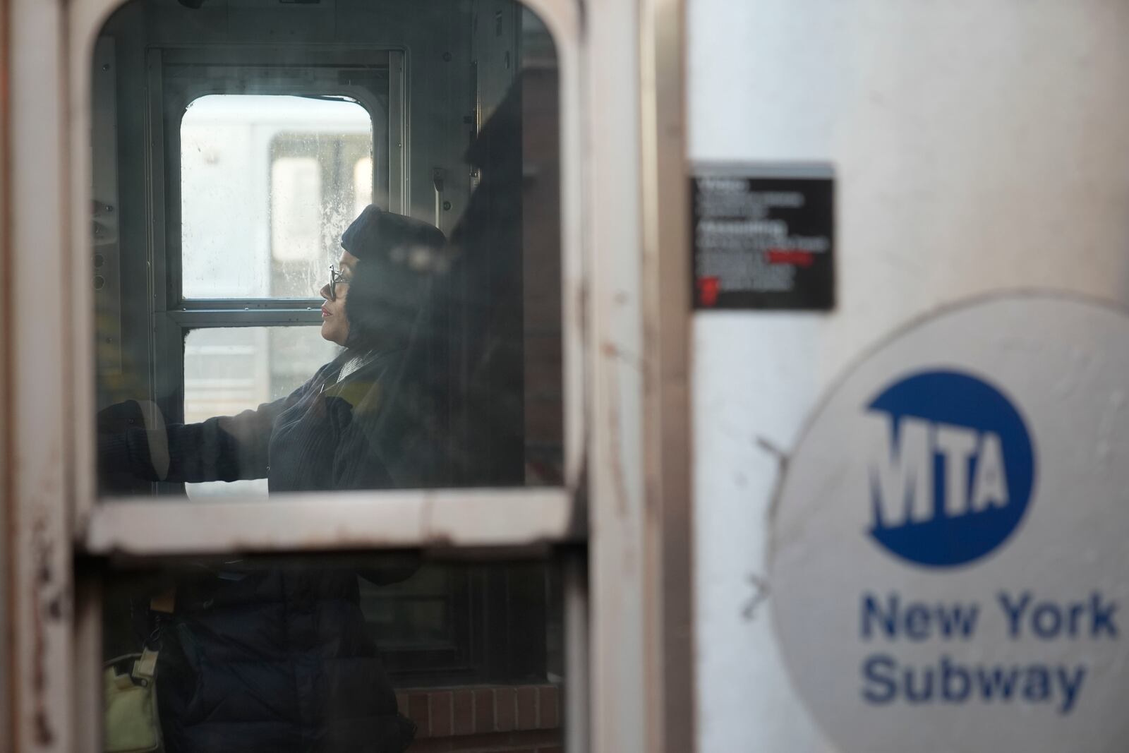 Subway train operator Tyesha Elcock gets settled in the driver's compartment before departing the Coney Island section of New York, Thursday, Jan. 23, 2025. (AP Photo/Seth Wenig)