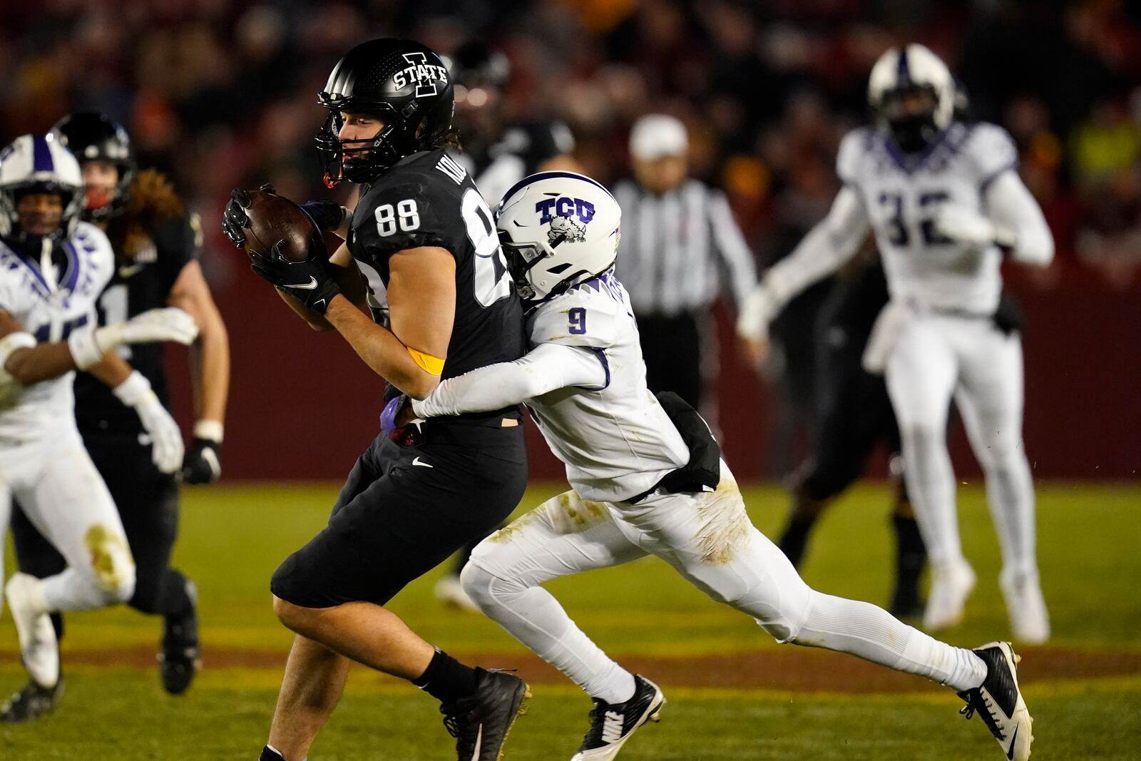 Iowa State tight end Charlie Kolar (88) catches a pass ahead of TCU cornerback C.J. Ceasar II (9) during the second half an NCAA college football game, Friday, Nov. 26, 2021, in Ames, Iowa. Iowa State won 48-14. (AP Photo/Charlie Neibergall)