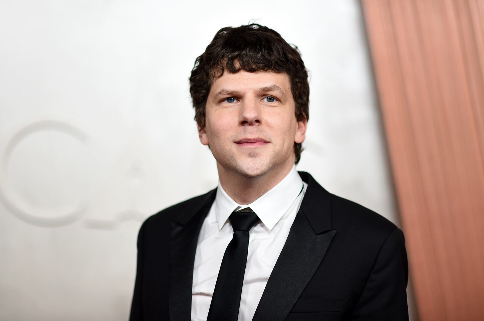 Jesse Eisenberg arrives at the Oscars on Sunday, March 2, 2025, at the Dolby Theatre in Los Angeles. (Photo by Richard Shotwell/Invision/AP)