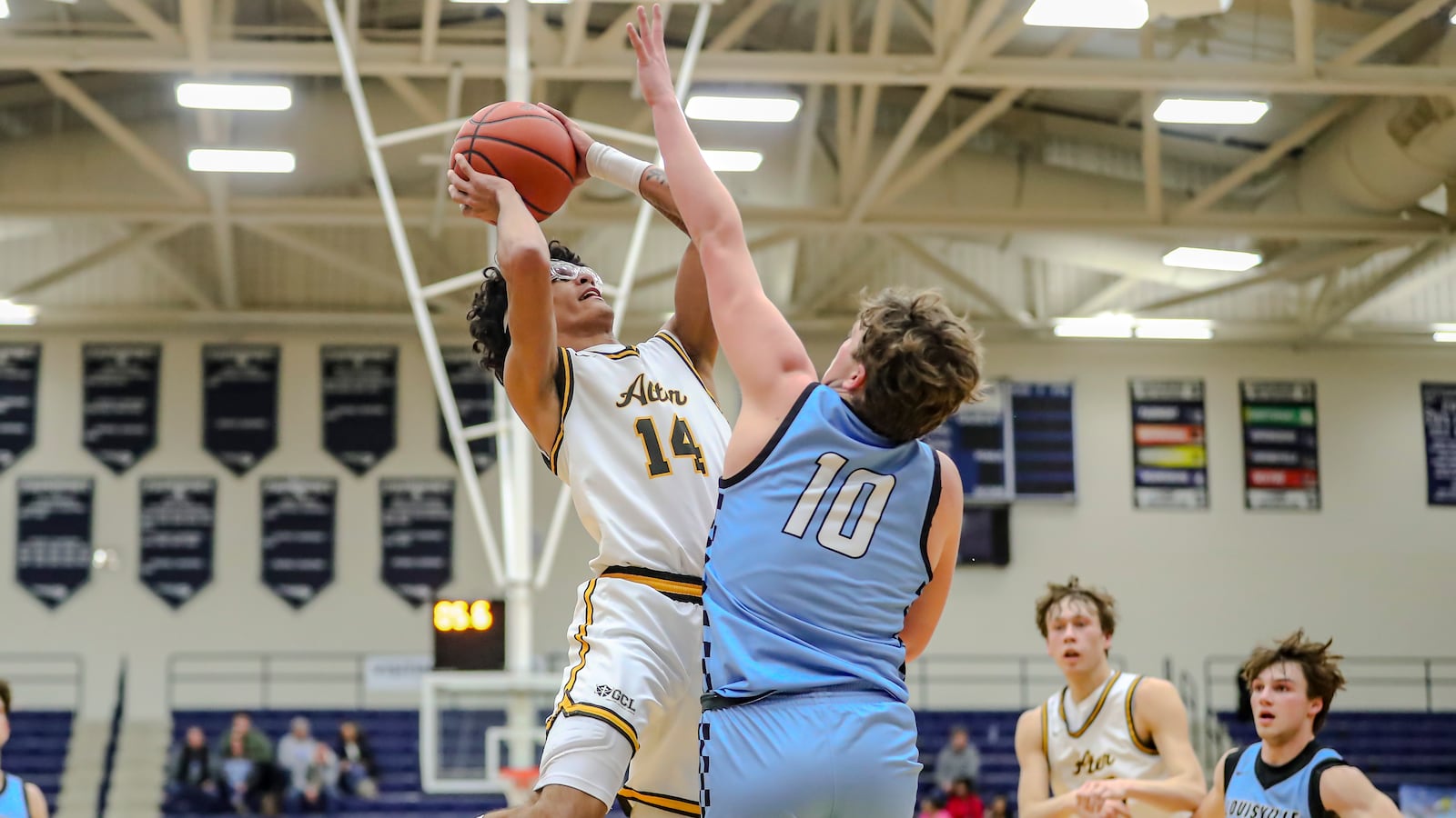 Alter High School senior RJ Greer drives to the hoop against Louisville senior Tate Ajancic during their game on Saturday night at The Beacon Orthopaedics Flyin’ to the Hoop Invitational on Saturday night at Trent Arena in Kettering. MICHAEL COOPER/CONTRIBUTED