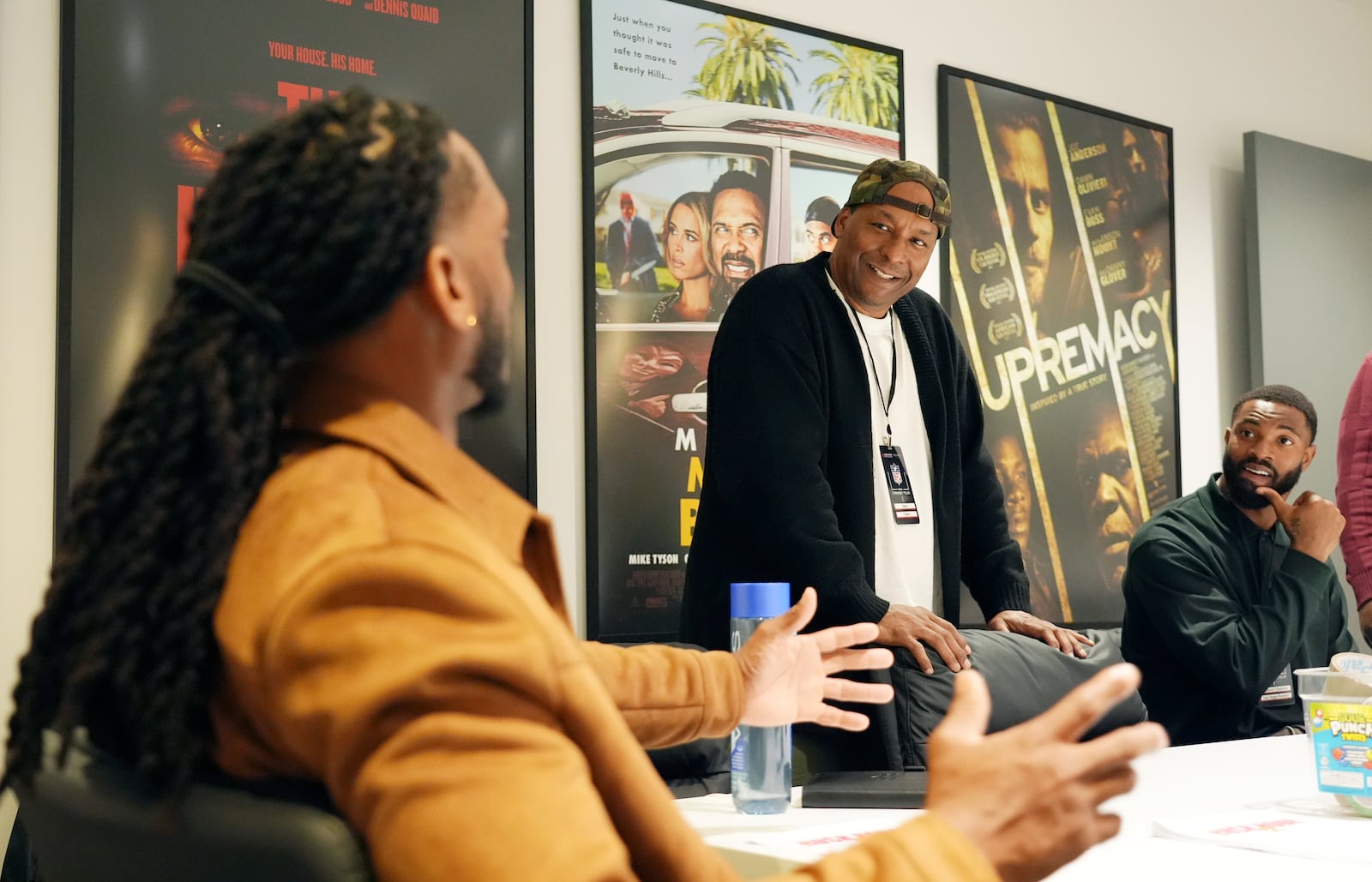 Filmmaker and former professional basketball player Deon Taylor, center, discusses the movie industry with NFL players Trayvon Henderson, left, and K'Lavon Chaisson during a filmmaking workshop for NFL players on Tuesday, March 4, 2025, in Santa Monica, Calif. (AP Photo/Chris Pizzello)