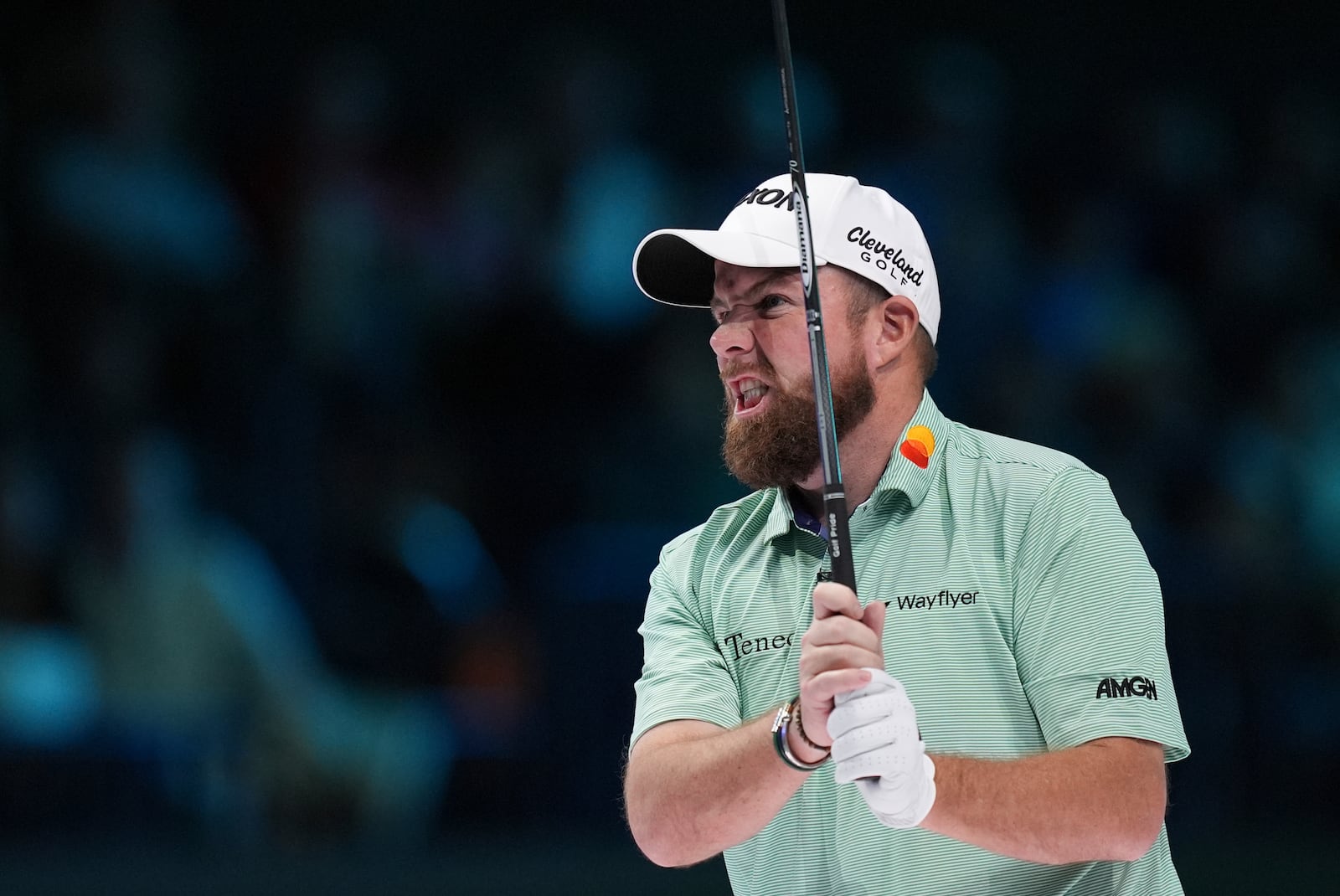 Shane Lowry of The Bay Golf Club watches a shot on the tenth hole, during the inaugural match of the TMRW Golf League, against New York Golf Club, Tuesday, Jan. 7, 2025, in Palm Beach Gardens, Fla. TGL features six teams of four players competing against each other in a tech-infused arena the size of a football field. (AP Photo/Rebecca Blackwell)