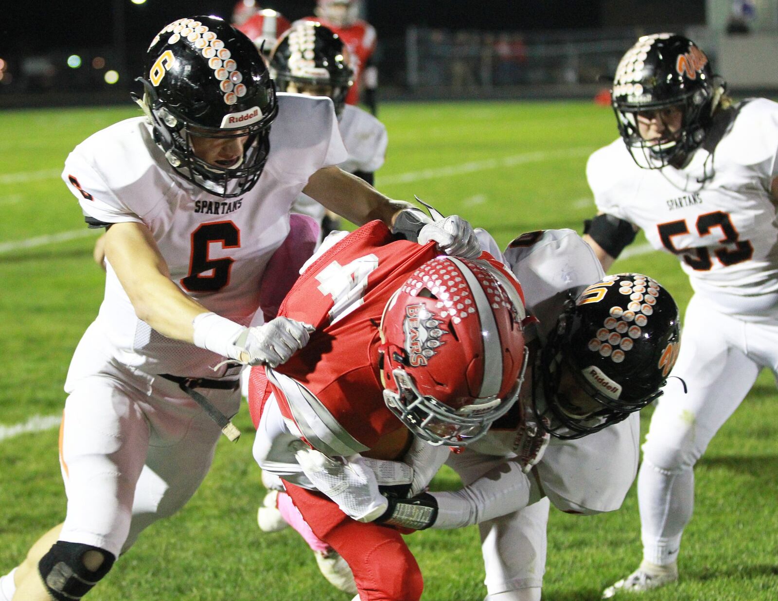 Isaiah McCallop of Northridge (with ball) is taken down by Seth Bloom (left) and Paul Dotson. Waynesville defeated host Northridge 23-8 in a Week 9 high school football game on Thursday, Oct. 24, 2019. MARC PENDLETON / STAFF