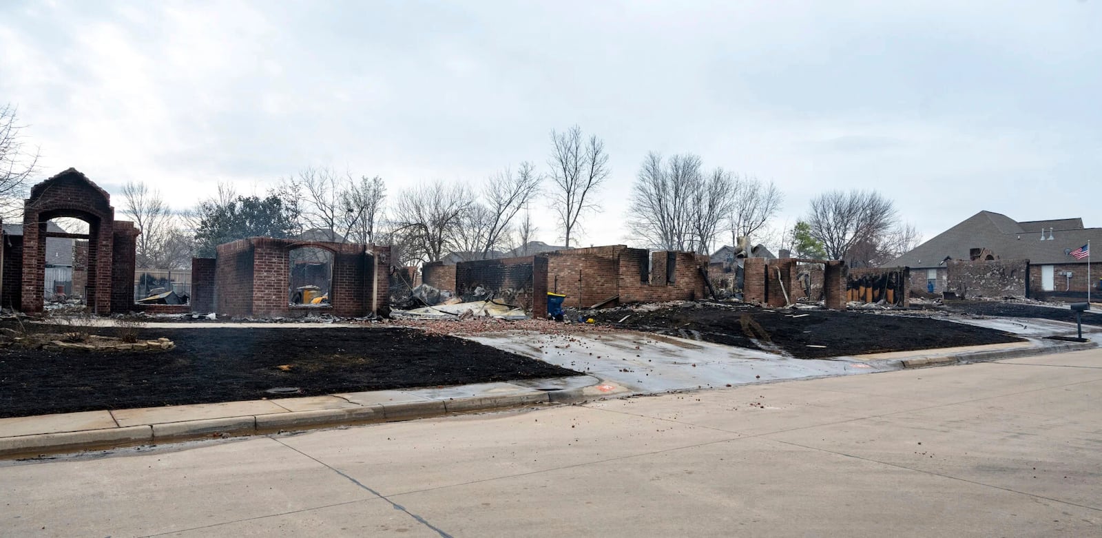 A row of houses on the west edge of Stillwater, Okla., Saturday, March 15, 2025, were among more than 50 homes and structures burned down due to wildfires. (Jason Elmquist/The News Press via AP)