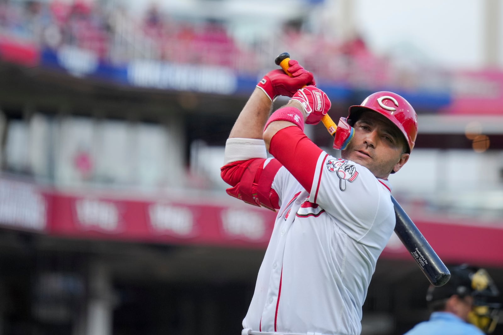 FILE - Cincinnati Reds' Joey Votto takes a practice swing as he waits on deck to bat during a baseball game against the Arizona Diamondbacks in Cincinnati, Saturday, July 22, 2023. Votto's $20 million option for 2024 was declined Saturday, Nov. 4, 2023, by the Reds, making the first baseman a free agent and possibly ending his career with Cincinnati after 17 seasons. Votto will get a $7 million buyout, completing a contract that guaranteed $251.5 million over 12 seasons. (AP Photo/Aaron Doster, FIle)