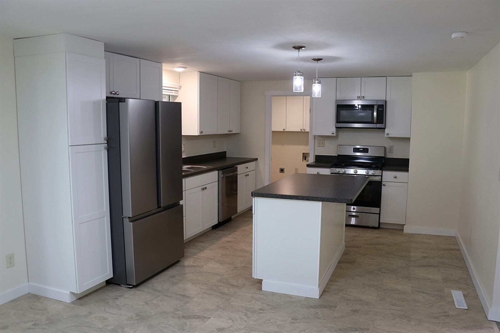 At the back of the home is the completely redesigned kitchen and dining area combination. 