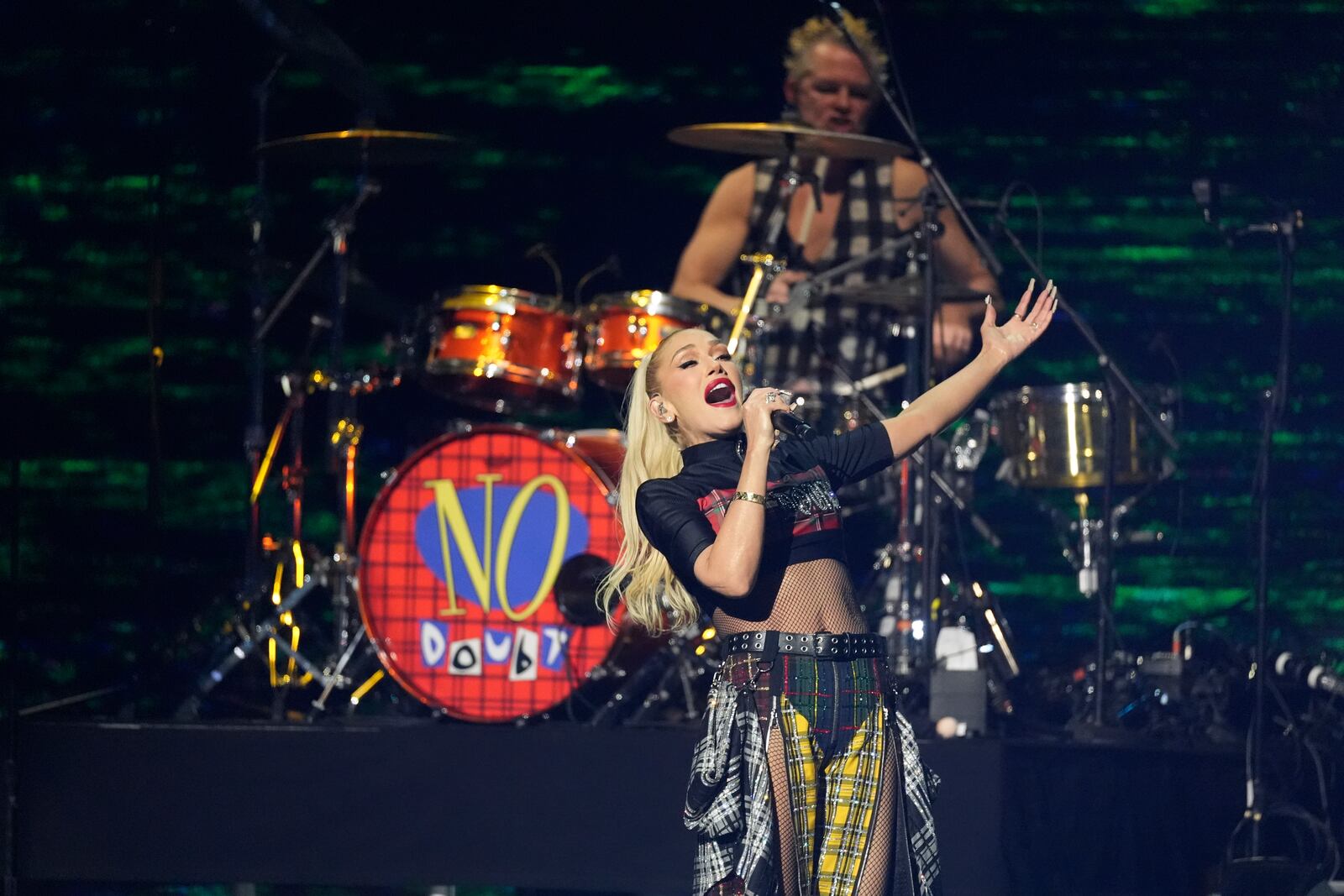 Gwen Stefani, left, of No Doubt, and Adrian Young perform during the FireAid benefit concert on Thursday, Jan. 30, 2025, at The Forum in Inglewood, Calif. (AP Photo/Chris Pizzello)