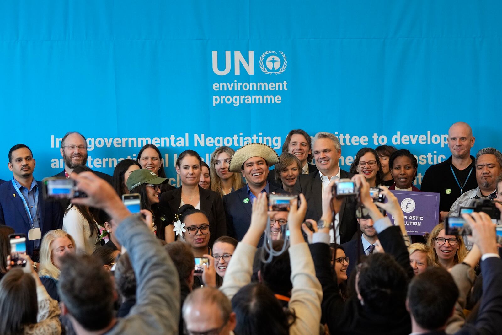 FILE - Juliet Kabera, third from right, director general of the Rwanda Environment Management Authority, Anthony Agotha, special envoy for Climate and Environment Diplomacy, European Union, Panama's Juan Carlos Monterrey, Olga Givernet, French Delegate Minister for Energy and Mexico's Camila Zepeda pose after a news conference at the fifth session of the Intergovernmental Negotiating Committee on Plastic Pollution in Busan, South Korea, Dec. 1, 2024. (AP Photo/Ahn Young-joon)