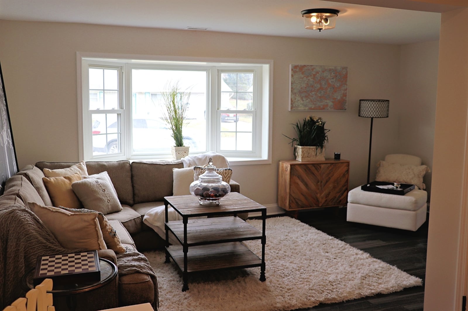 A bay window fills the combination family-media room with natural light. CONTRIBUTED BY KATHY TYLER