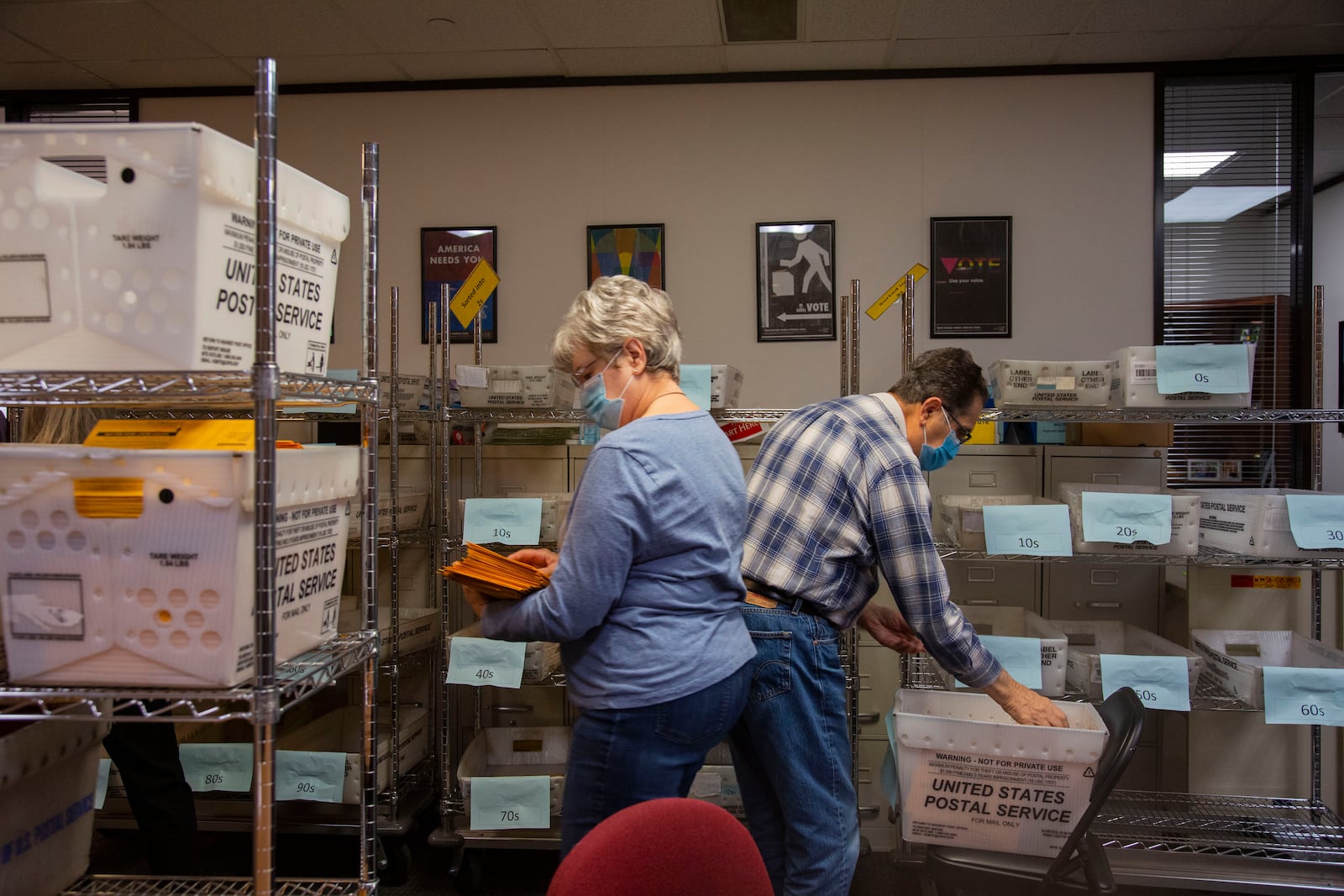 Election workers process ballots in Omaha, Neb., Nov. 3, 2020. The lone Electoral College vote awarded by Nebraska’s Second Congressional District has gone to Democratic presidential nominee Joe Biden. It could be the vote that gets him to 270. (Calla Kessler/The New York Times)