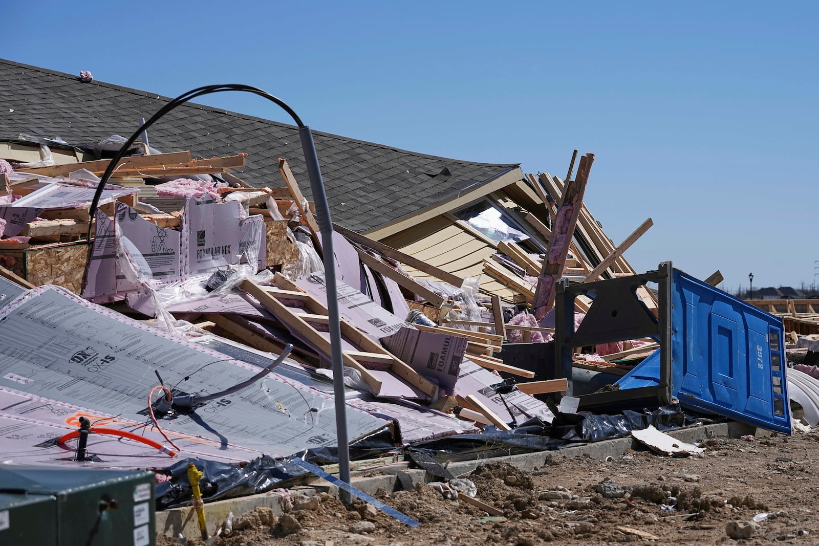 Homes that were under construction sit destroyed after recent severe weather passed through the area in Haslet, Texas, Wednesday, March 5, 2025. (AP Photo/Tony Gutierrez)