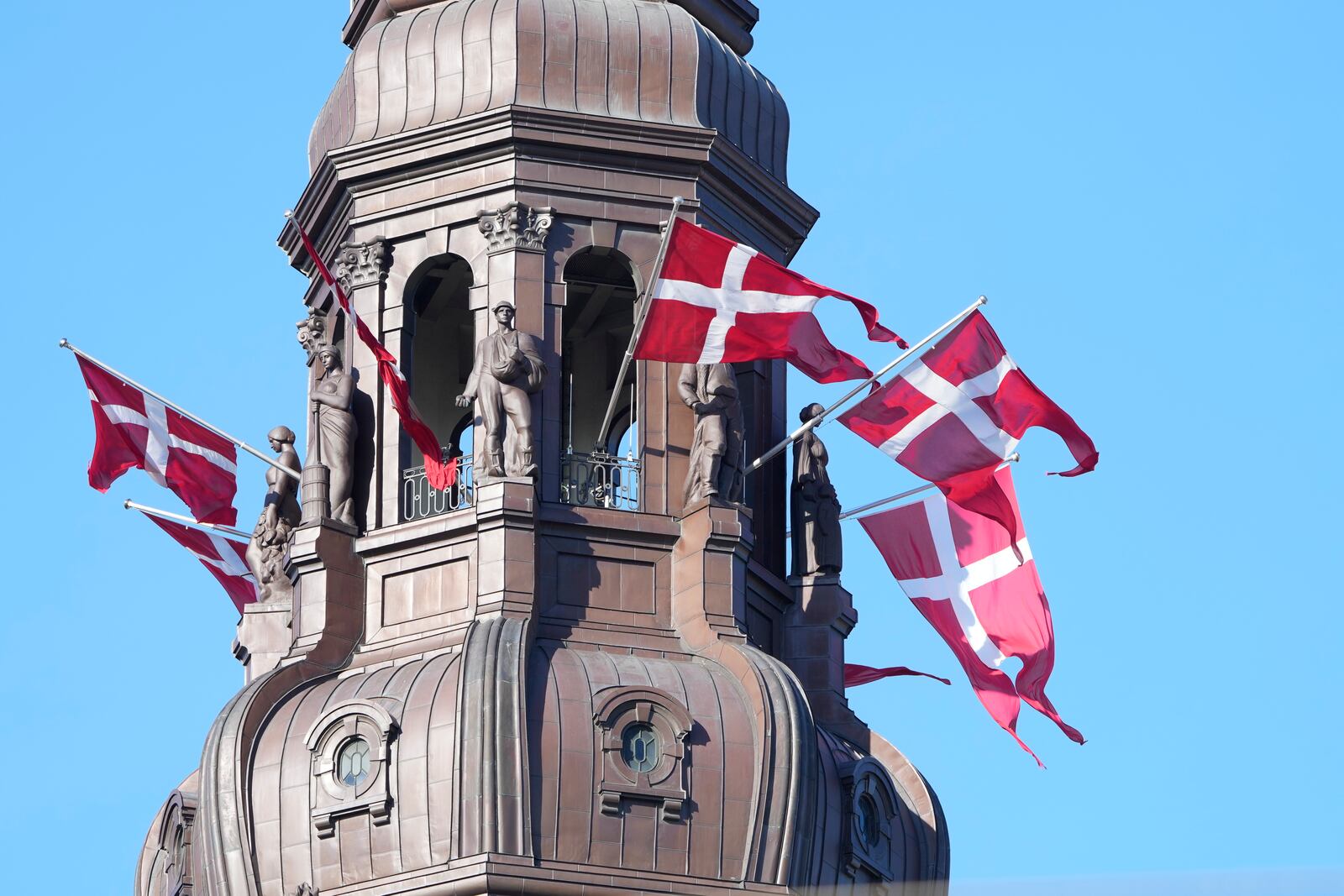 FILE - Danish flags are attached to the spire of Christiansborg Castle, the Danish Parliament building in Copenhagen, Denmark, Sept. 5, 2021. (Keld Navntoft/Ritzau Scanpix via AP, File)