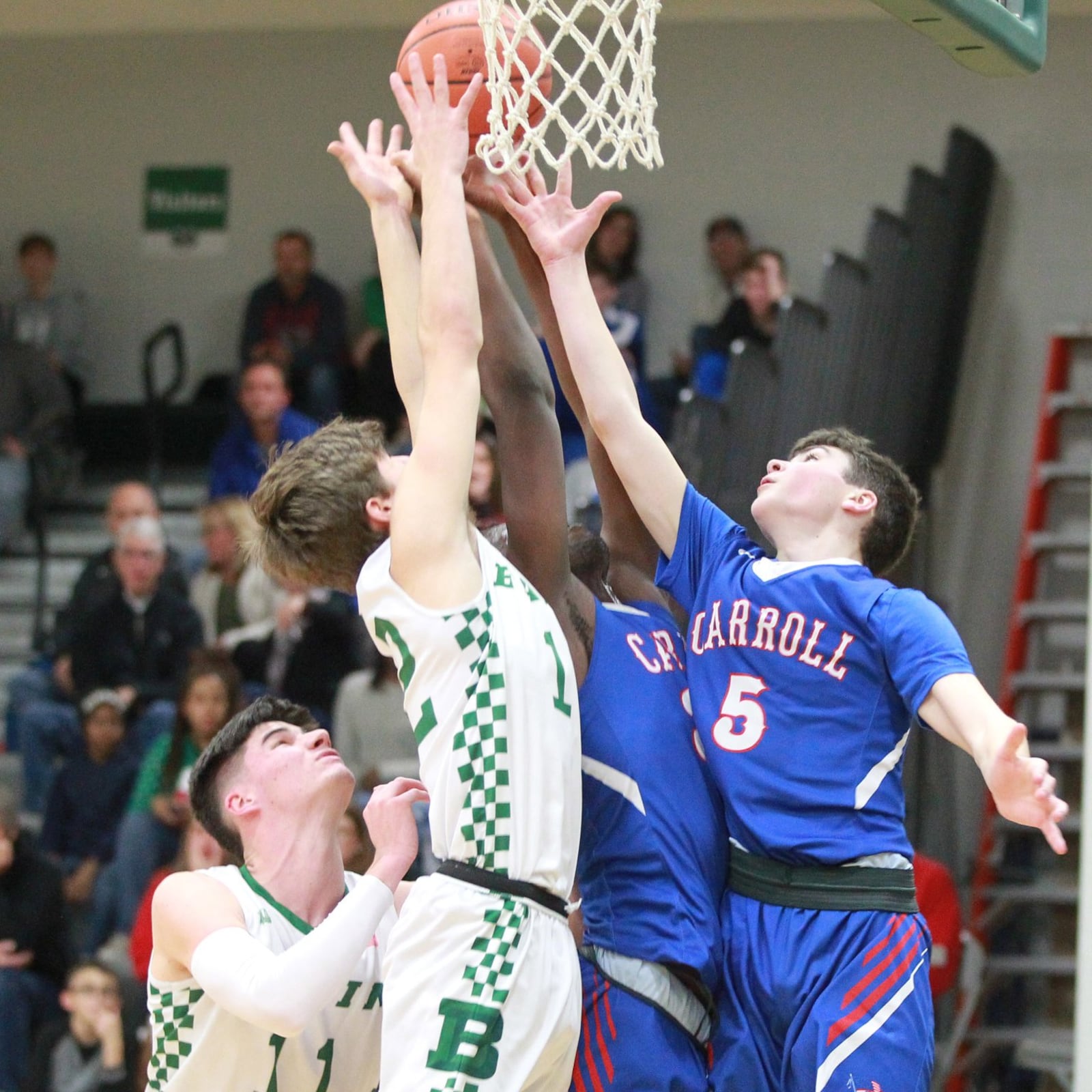 Paul Marot of Badin (left) contends for a rebound with Sean McKitrick (5) of Carroll. Badin defeated visiting Carroll 65-52 in a GCL Co-Ed boys high school basketball game on Friday, Dec. 20, 2019. MARC PENDLETON / STAFF