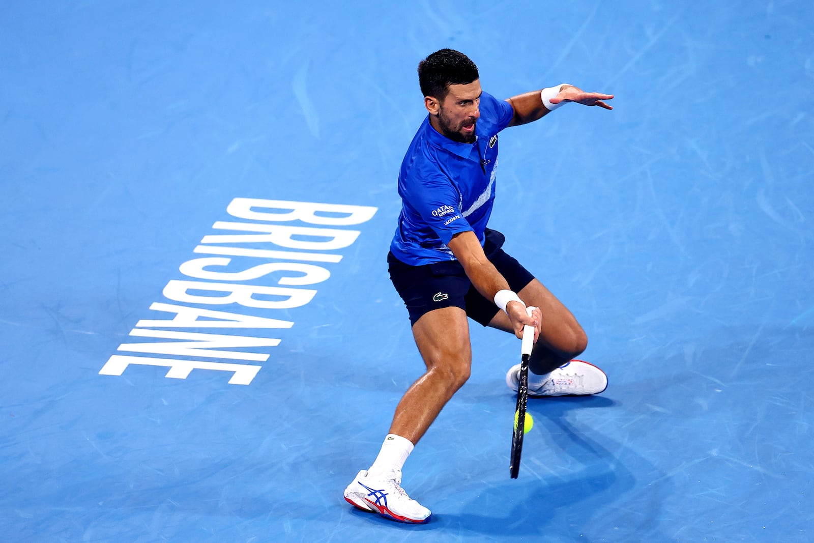 Serbia's Novak Djokovic plays a forehand to USA's Reilly Opelka during their match at the Brisbane International in Brisbane, Australia, Friday, Jan. 3, 2025. (AP Photo/Pat Hoelscher)