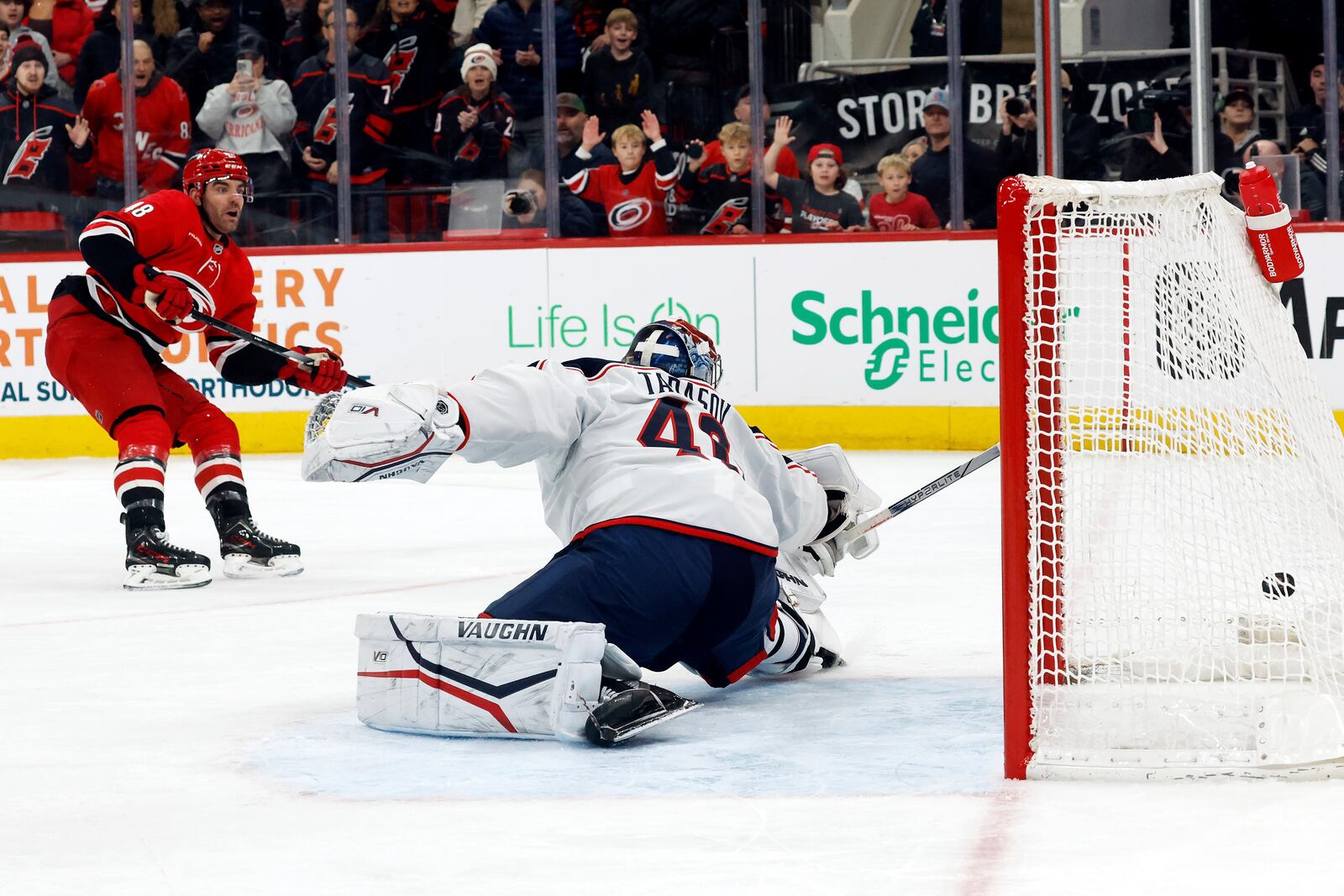 Carolina Hurricanes' Jordan Martinook (48) shoots the puck past Columbus Blue Jackets goaltender Daniil Tarasov (40) for a goal during the second period of an NHL hockey game in Raleigh, N.C., Thursday, Jan. 23, 2025. (AP Photo/Karl DeBlaker)