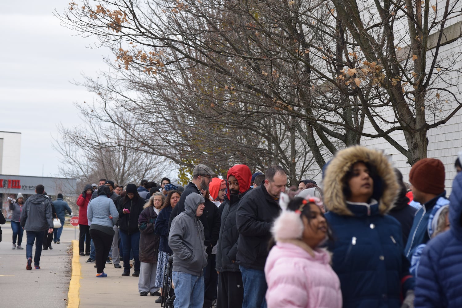 PHOTOS: Hundreds like up outside JCPenney for doorbusters, coupons