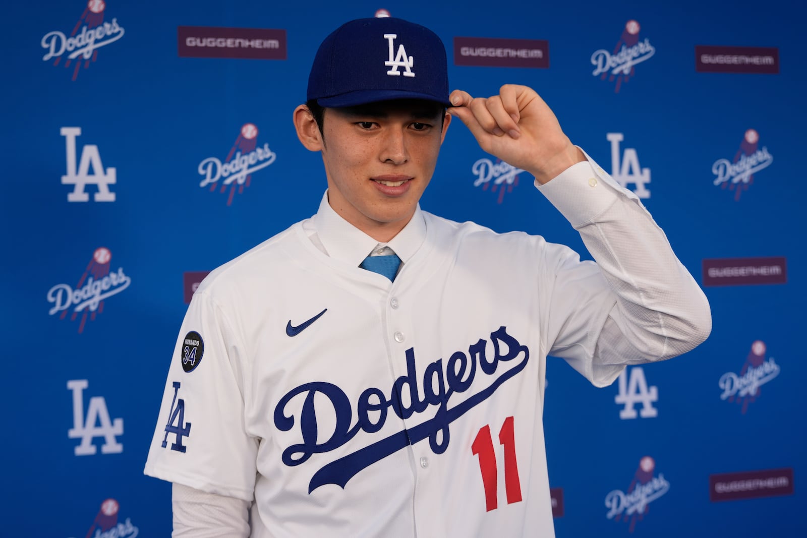 Japanese right-hander pitcher Roki Sasaki, 23, poses as he is introduced by the Los Angeles Dodgers at a news conference at Dodger Stadium Wednesday, Jan. 22, 2025 in Los Angeles. (AP Photo/Damian Dovarganes)