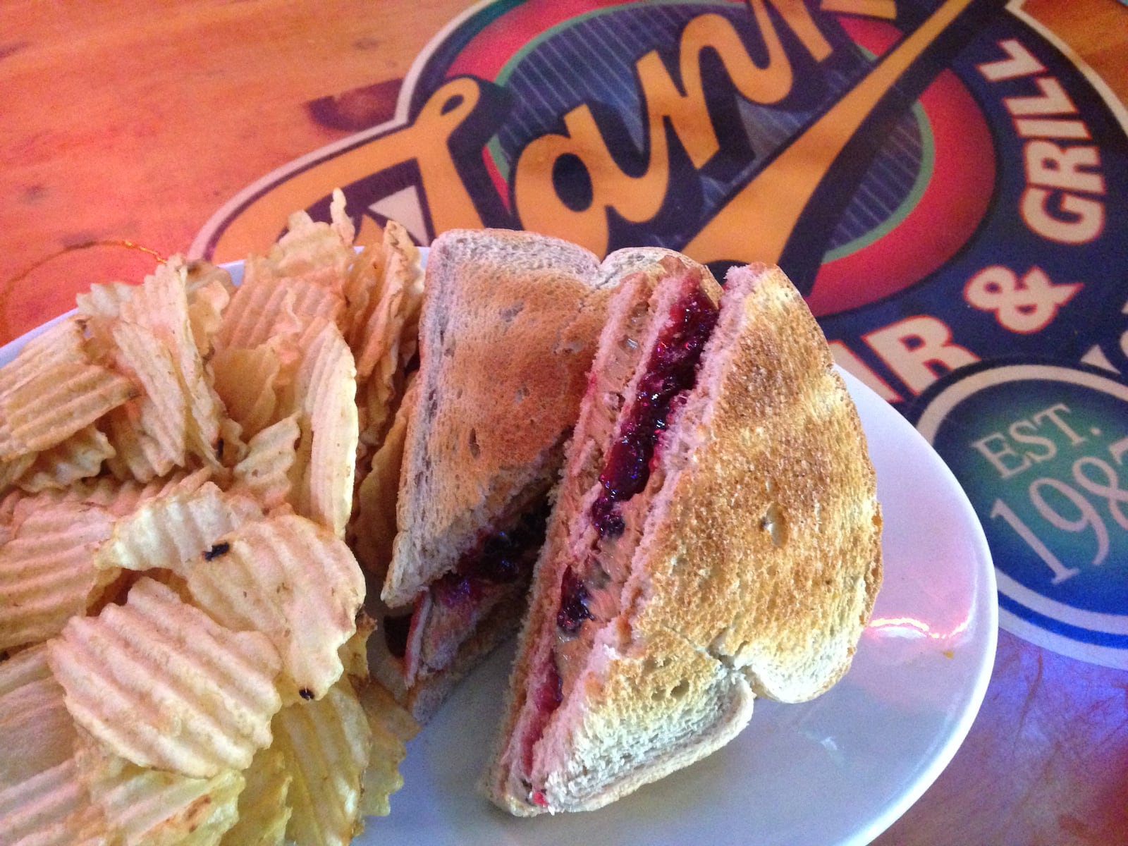 Tank’s Bar and Grill’s peanut butter and jelly club is $4.99 and comes with a mountain of chips. (Staff photo by Amelia Robinson)