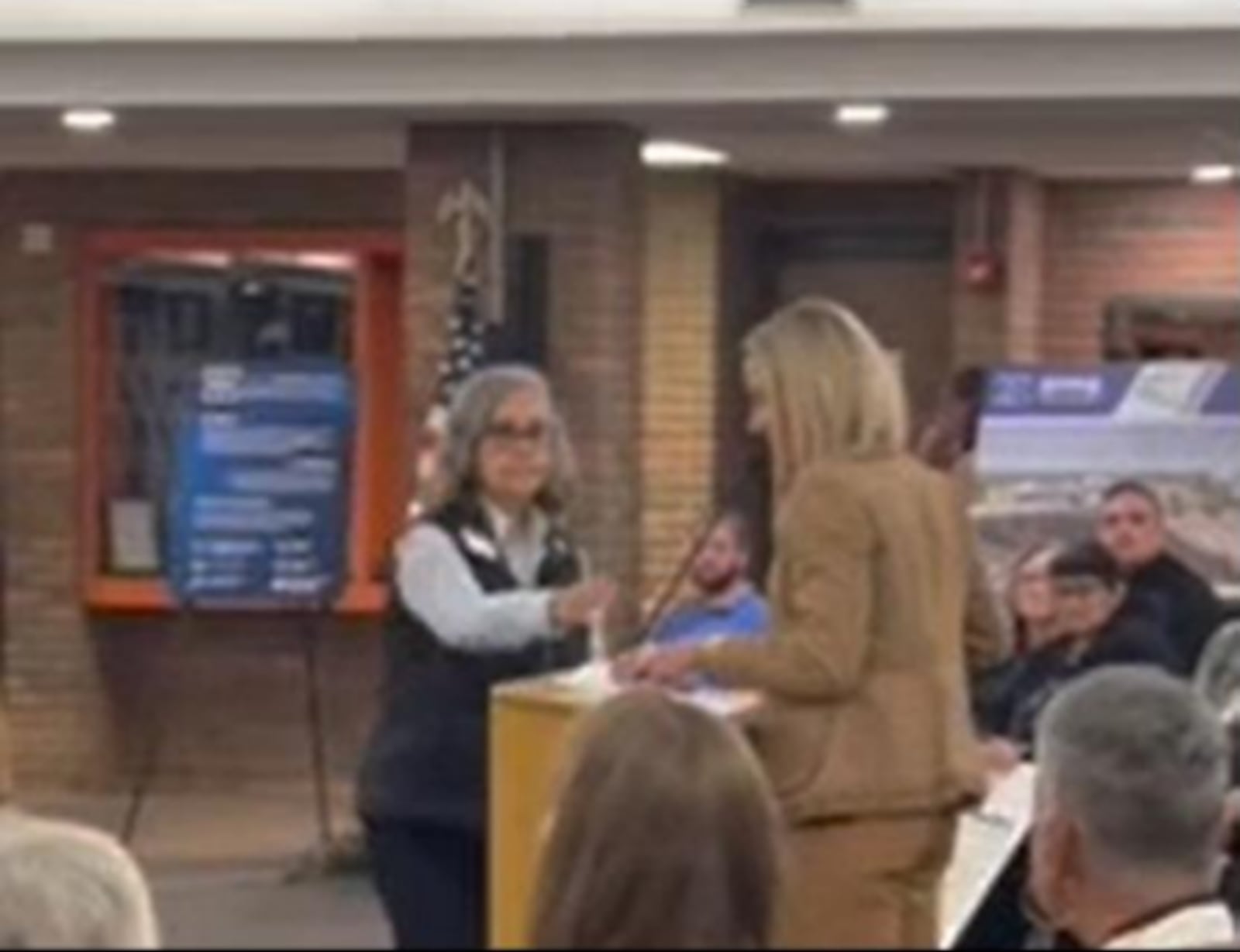 This photo of Xenia board president Mary Grech and former Lakota board member Darbi Boddy is from the Oct. 14 meeting where Boddy says Grech unlawfully took away her microphone during public comment. Photo from Boddy's lawsuit