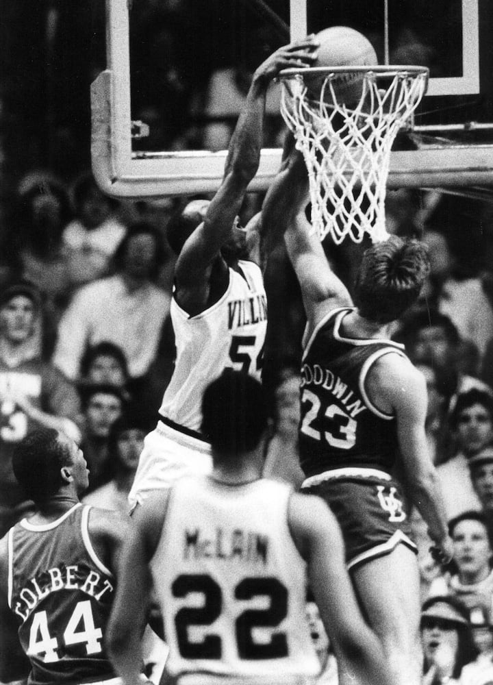 Villanova's Ed Pincknet, 54, slam dunks over UD's Damon Goodwin during a 1985 NCAA tournament games against the UD Flyers in Dayton. Pinckney has 20 points in the 2 point victory over UD. Villanove went on to win the NCAA championship that year.