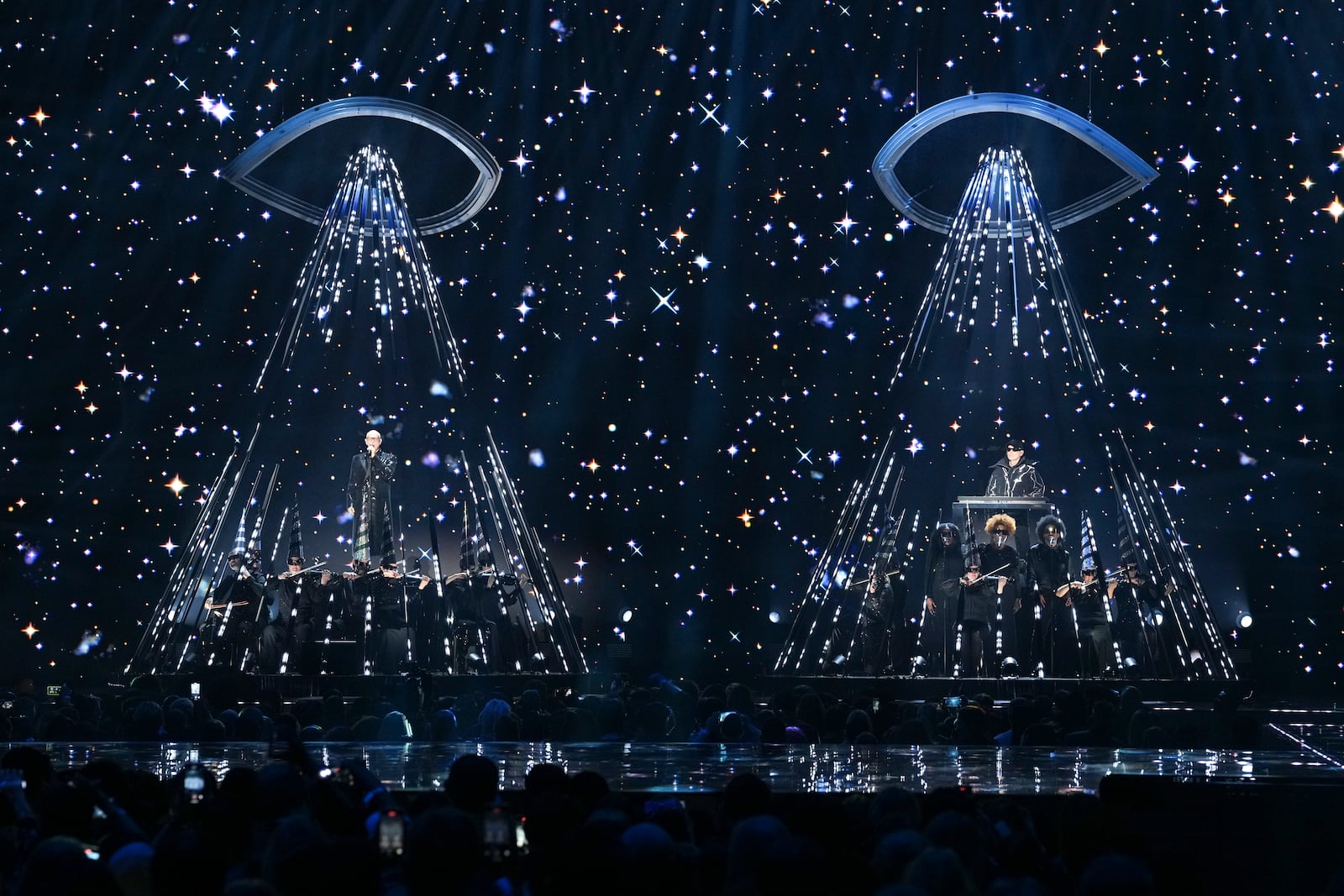 Neil Tennant, left, and Chris Lowe from the 'Pet Shop Boys' perform alongside the Manchester Camerata during the MTV European Music Awards in Manchester, England, Sunday, Nov. 10, 2024. (Scott A Garfitt/Invision/AP)