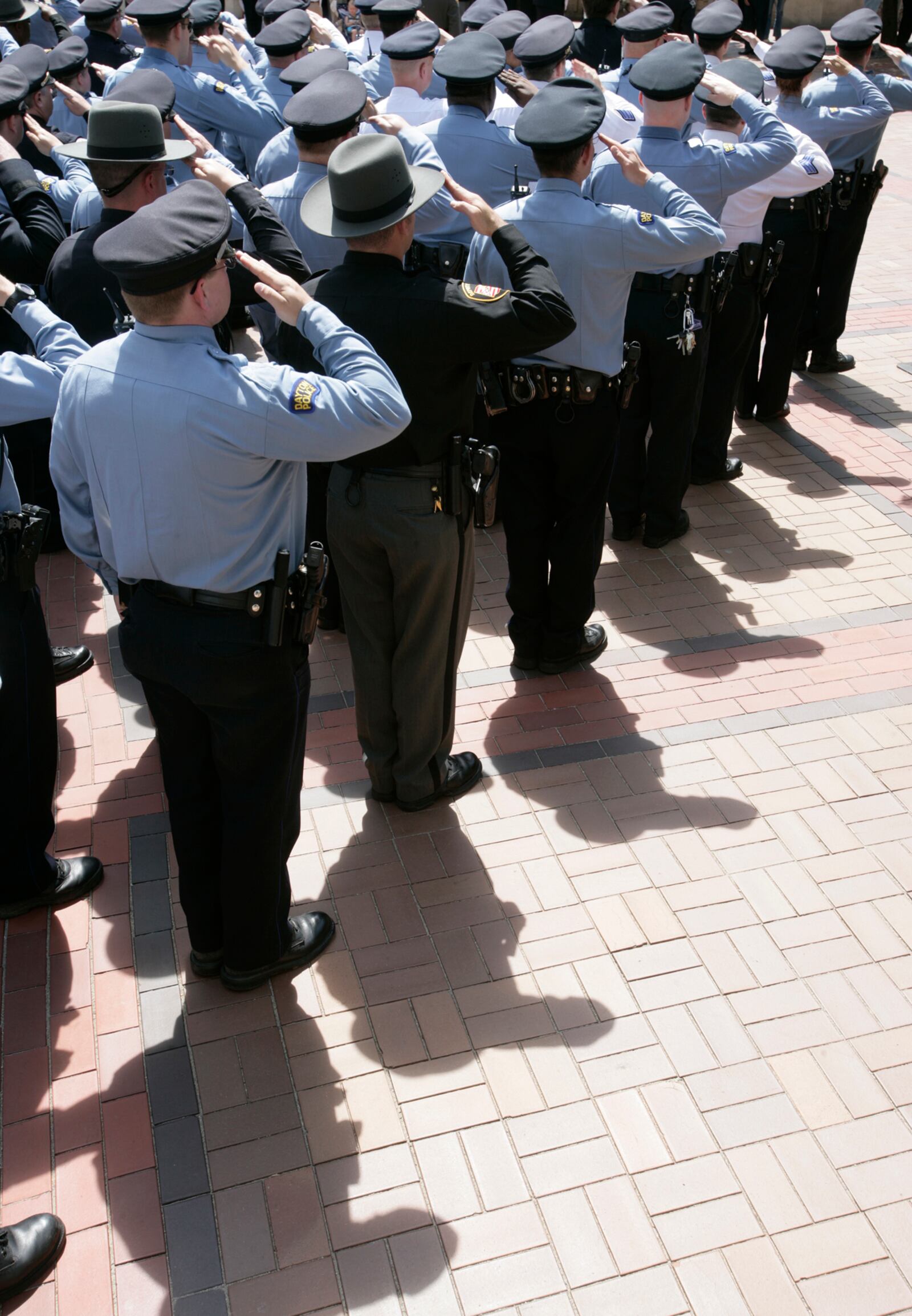 Law enforcement officers salute the flag during the 2007 Law Enforcement Memorial Ceremony on Courthouse Square.