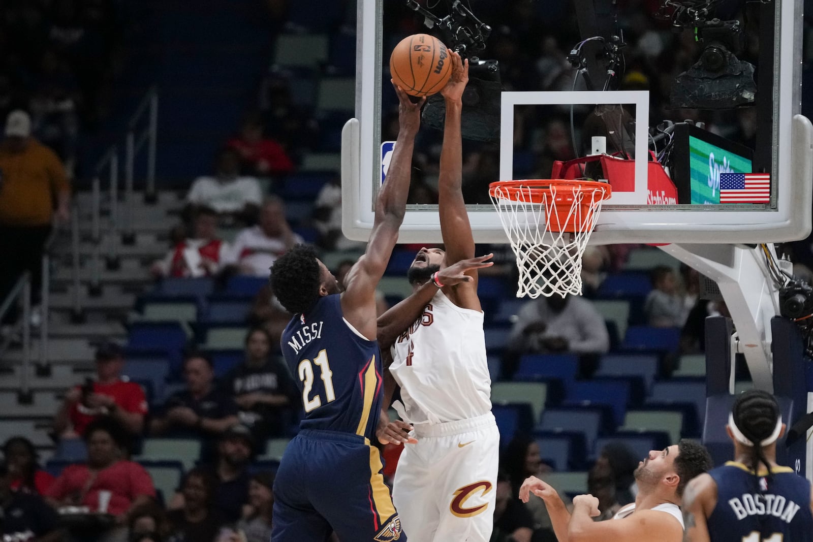 Cleveland Cavaliers forward Evan Mobley blocks a shot by New Orleans Pelicans center Yves Missi (21) in the first half of an NBA basketball game in New Orleans, Wednesday, Nov. 6, 2024. (AP Photo/Gerald Herbert)