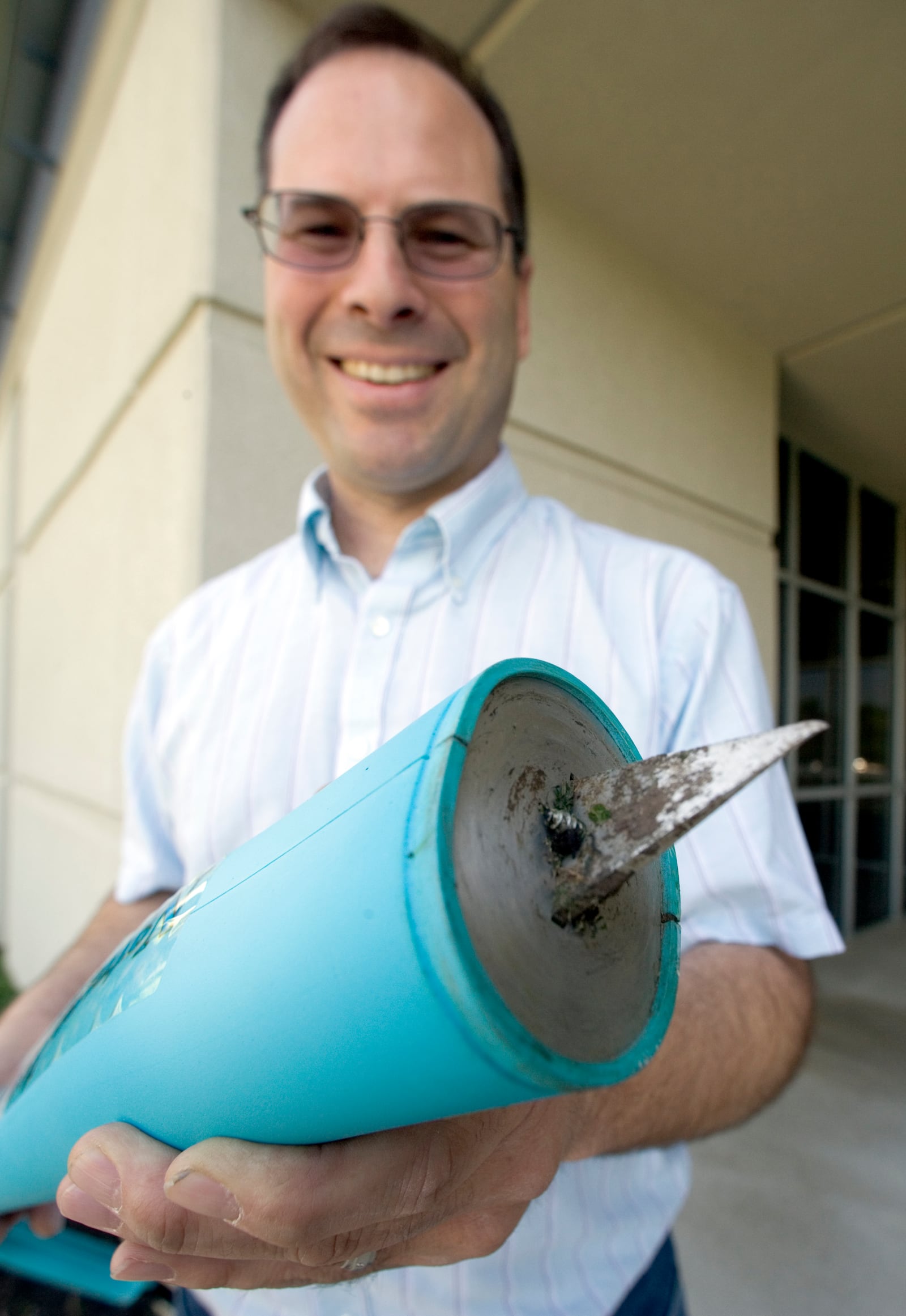 Jon Jackson, president of Global Neighbor, with his NatureZap weed killer that uses a heating element to destroy the roots of undesirable plants such as dandelions, in a 2010 file photo.