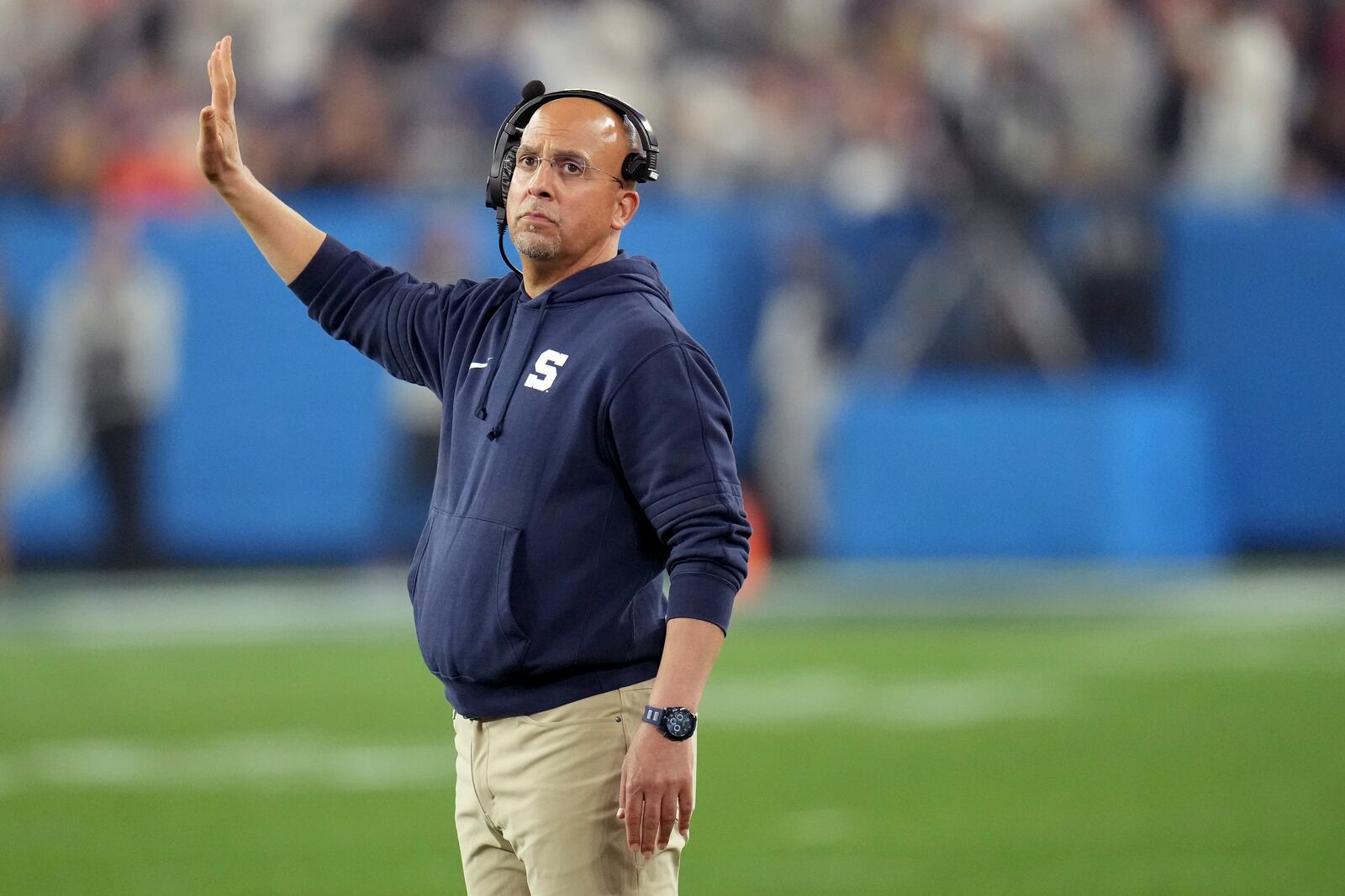 Penn State head coach James Franklin makes a call during the first half of the Fiesta Bowl NCAA college football CFP quarterfinal game against Boise State, Tuesday, Dec. 31, 2024, in Glendale, Ariz. (AP Photo/Ross D. Franklin)