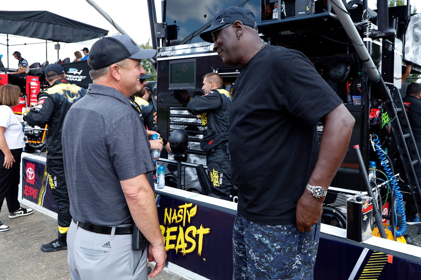 Bob Jenkins, owner of Front Row Motorsports and Co-Owner Michael Jordan, of 23XI Racing, talk before a NASCAR Cup Series auto race at Talladega Superspeedway, Sunday, Oct. 6, 2024, in Talladega, Ala. (AP Photo/ Butch Dill)