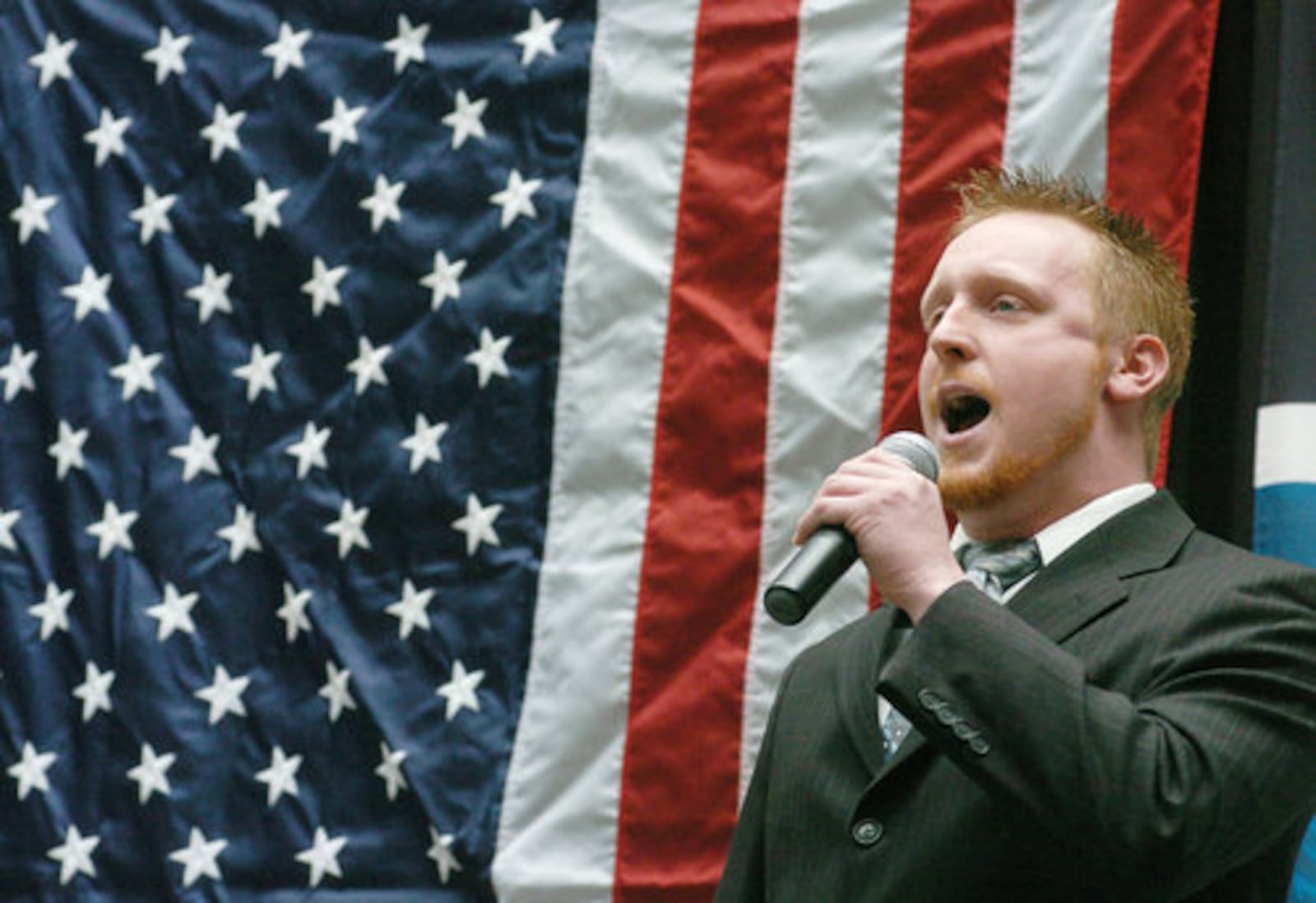 Andrew Hubbs singing the National Anthem during auditions at the Dayton Mall on Saturday with hopes of being selected for the Dayton Dragons season opening game