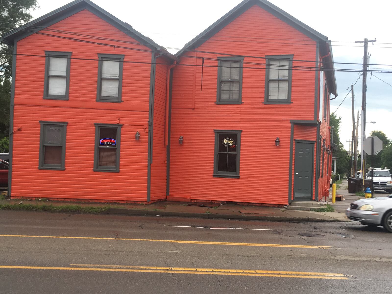 Brian Ferguson, the owner of Zada Paint Works, said he loves painting some of the city's oldest buildings.  His work includes the South Park Tavern building.  This photo was taken after Ferguson applied paint.