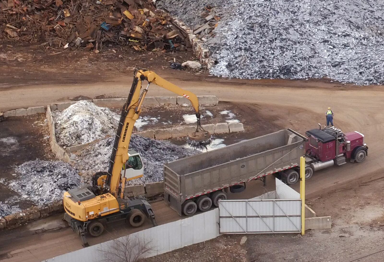 A magnetic crane loads ferrous metal at Franklin Iron and Metal.    TY GREENLEES / STAFF