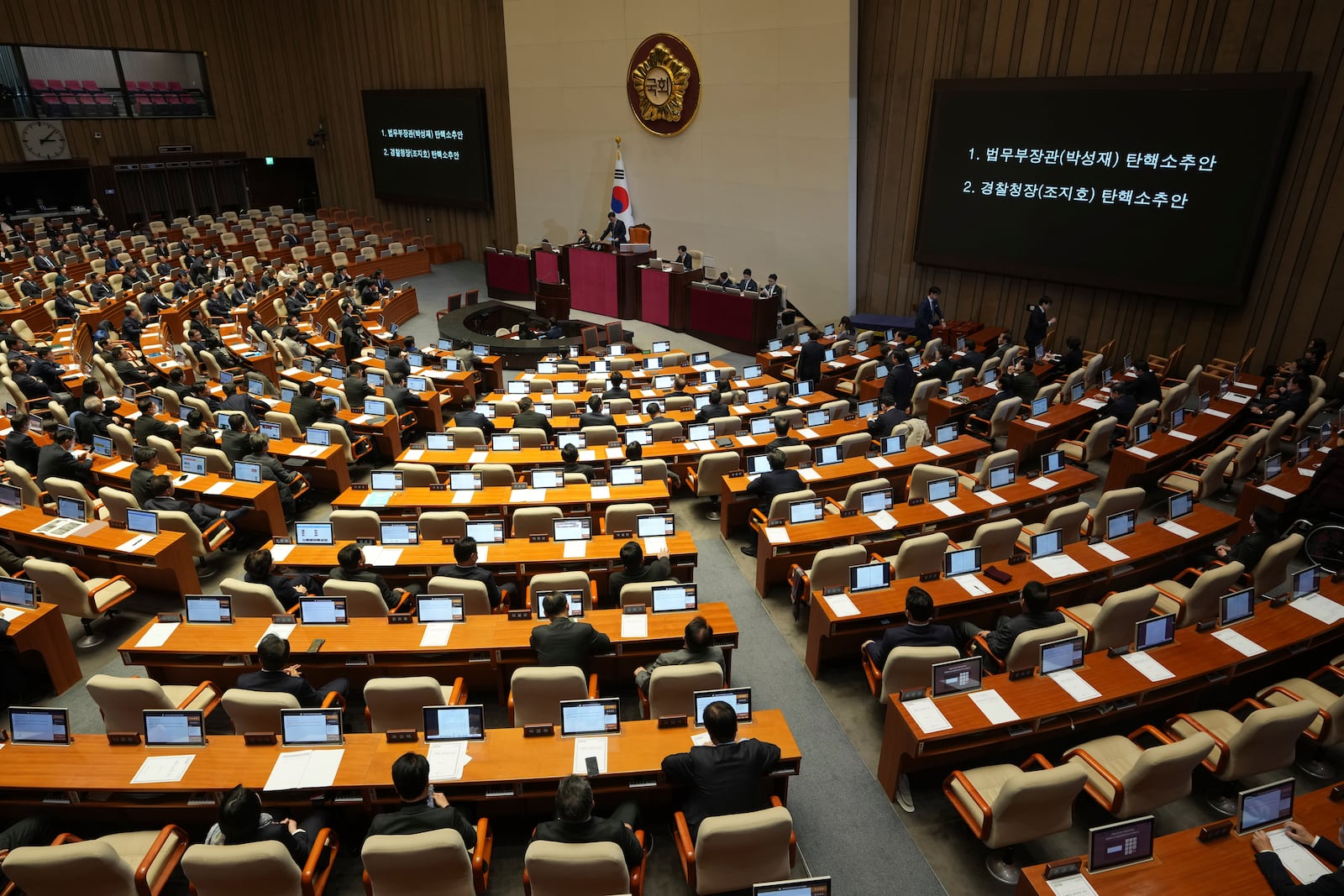 South Korea's National Assembly Speaker Woo Won-shik, center top, speaks during a plenary session held relating to the martial law declaration, at the National Assembly in Seoul, South Korea, Thursday, Dec. 12, 2024. (AP Photo/Lee Jin-man)