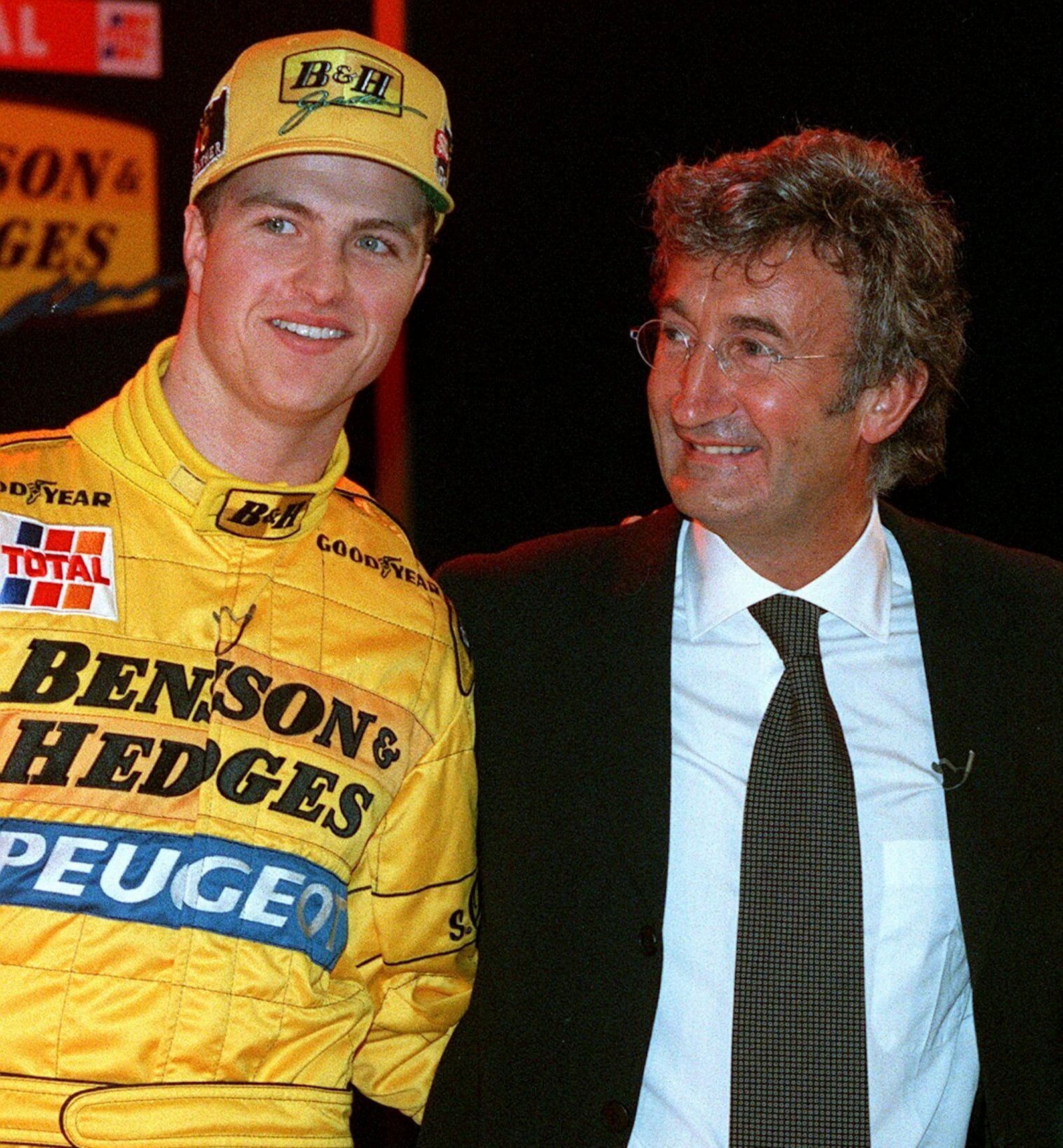 FILE - Germany's Ralf Schumacher, left, poses for a photo with Jordan Formula One team owner Eddie Jordan at the launch of the new seasons car in London January 30, 1997. (AP Photo/Alastair Grant, File)