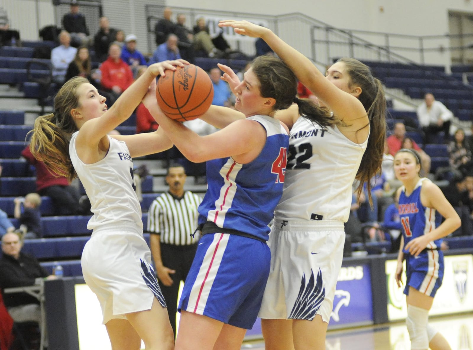 Fairmont’s Mallory Hullinger (left), Julia Keller of Carroll and Madison Bartley of Fairmont contend for a rebound. Carroll defeated host Fairmont 64-60 in double-OT in a girls high school basketball game at Trent Arena on Monday, Jan. 28, 2019. MARC PENDLETON / STAFF