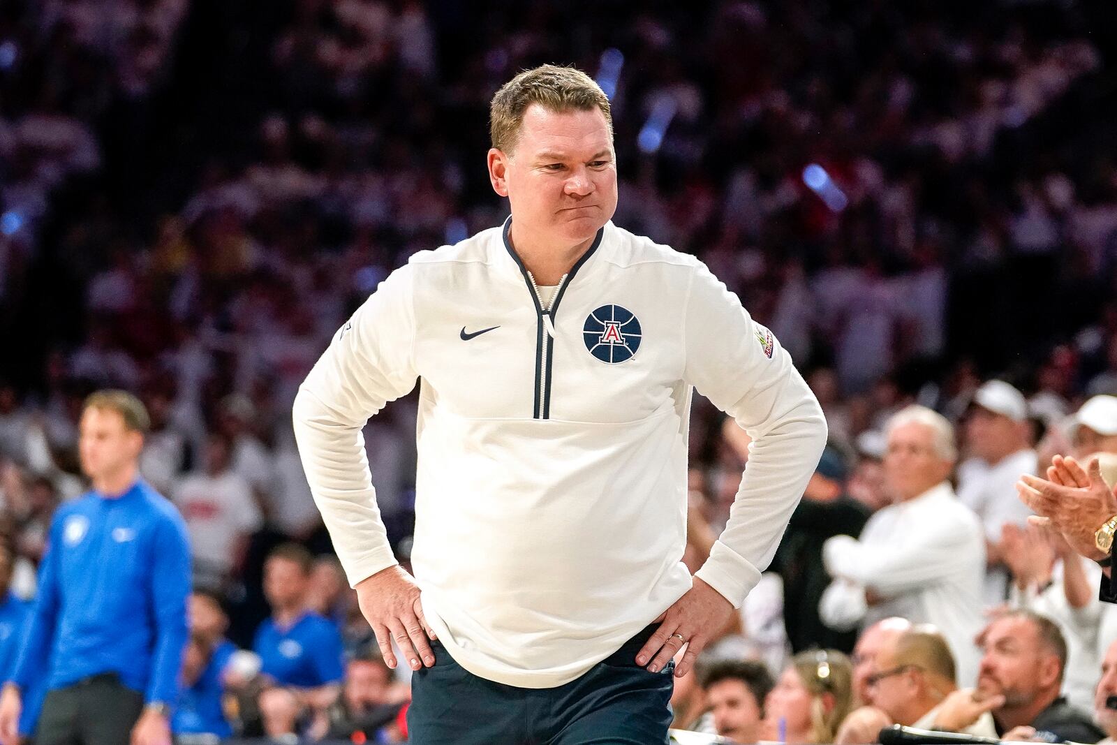 Arizona Wildcats coach Tommy Lloyd reacts to a call against his team during the second half of an NCAA college basketball game against Duke Friday, Nov. 22, 2024, in Tucson, Ariz. (AP Photo/Darryl Webb)