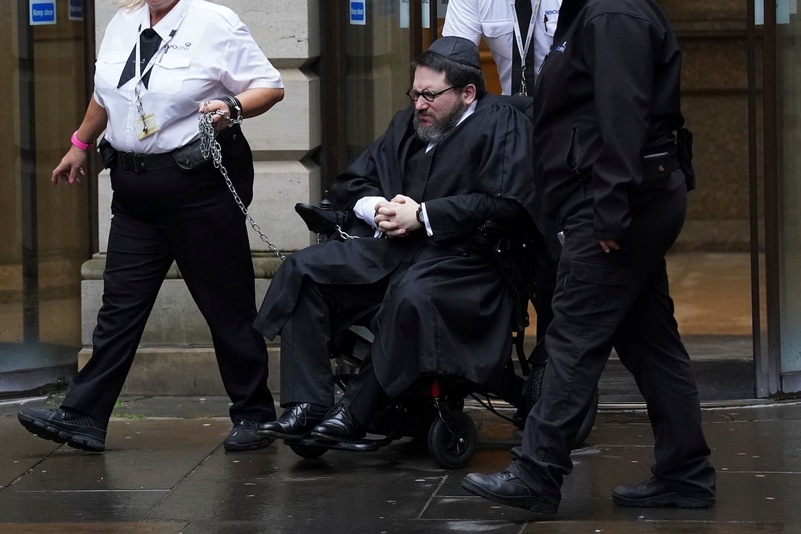 Nicholas Rossi leaves Edinburgh Sheriff and Justice of the Peace Court after an extradition hearing, in Edinburgh, Tuesday, June 27, 2023. Rossi has been fighting extradition to the United States to escape charges of identity theft, fraud and a sexual assault charge in Utah. (Andrew Milligan/PA via AP)