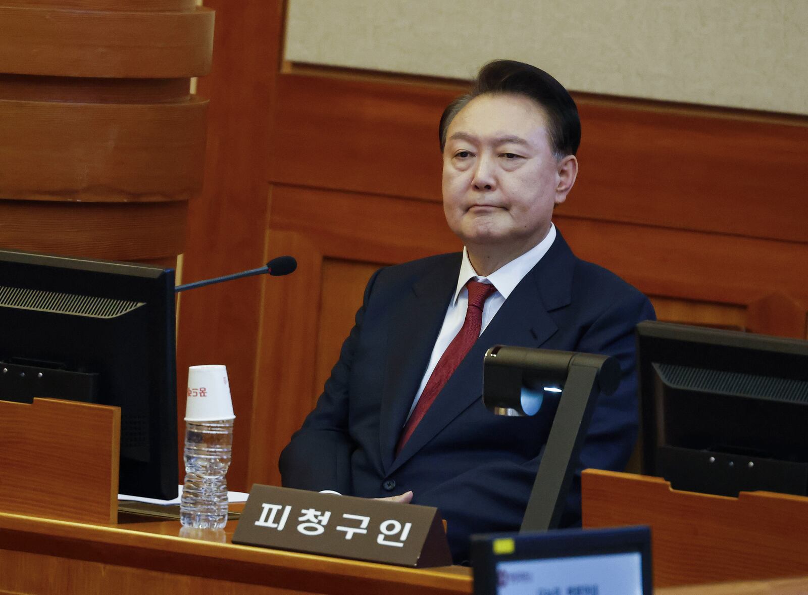 FILE- South Korea's impeached President Yoon Suk Yeol attends the fourth hearing of his impeachment trial over his short-lived imposition of martial law at the Constitutional Court in Seoul, South Korea, Thursday, Jan. 23, 2025. (Jeon Heon Kyun/Pool Photo via AP, File)