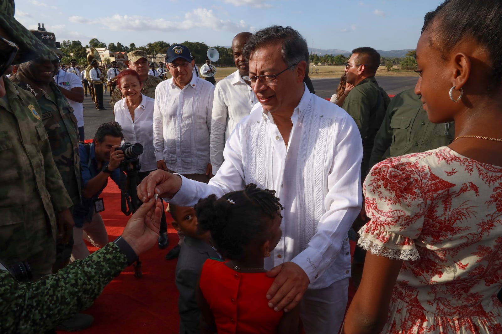 Colombia's President Gustavo Petro greets people upon arriving in Jacmel, Haiti, Wednesday, Jan. 22, 2025. (AP Photo/Patrice Noel)